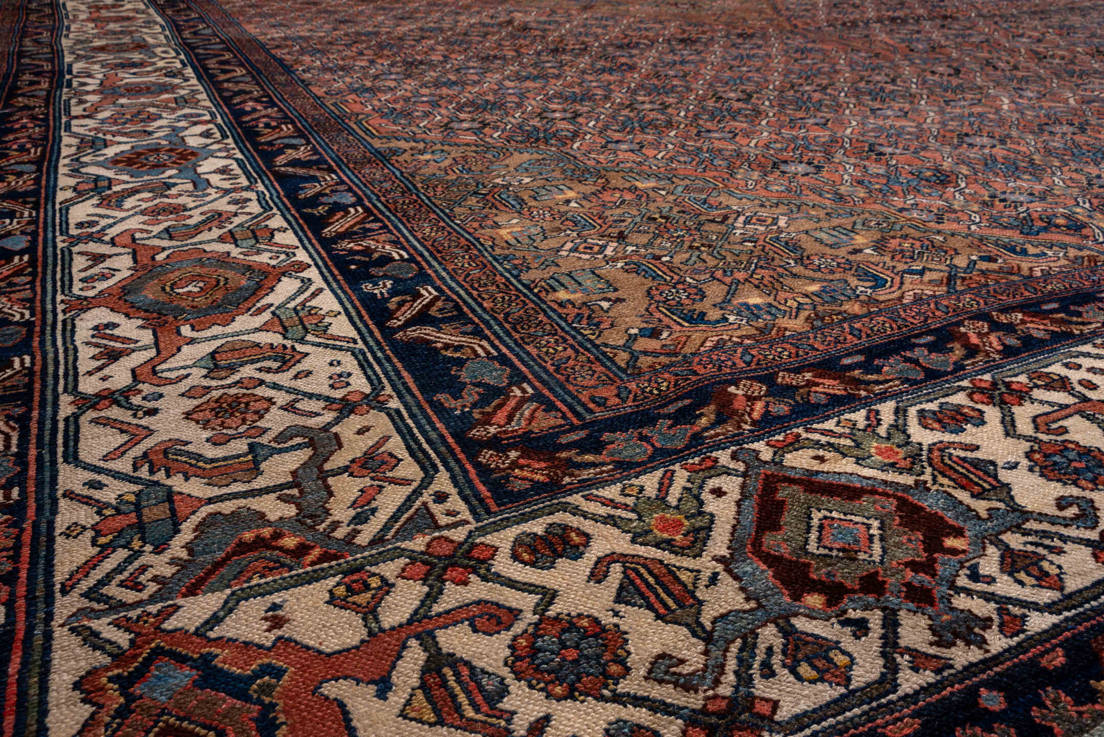 12' x 21' one-of-a-kind handmade antique Bibikabad oversize rug. Color palette: rust, navy, ivory, camel, terra cotta, slate