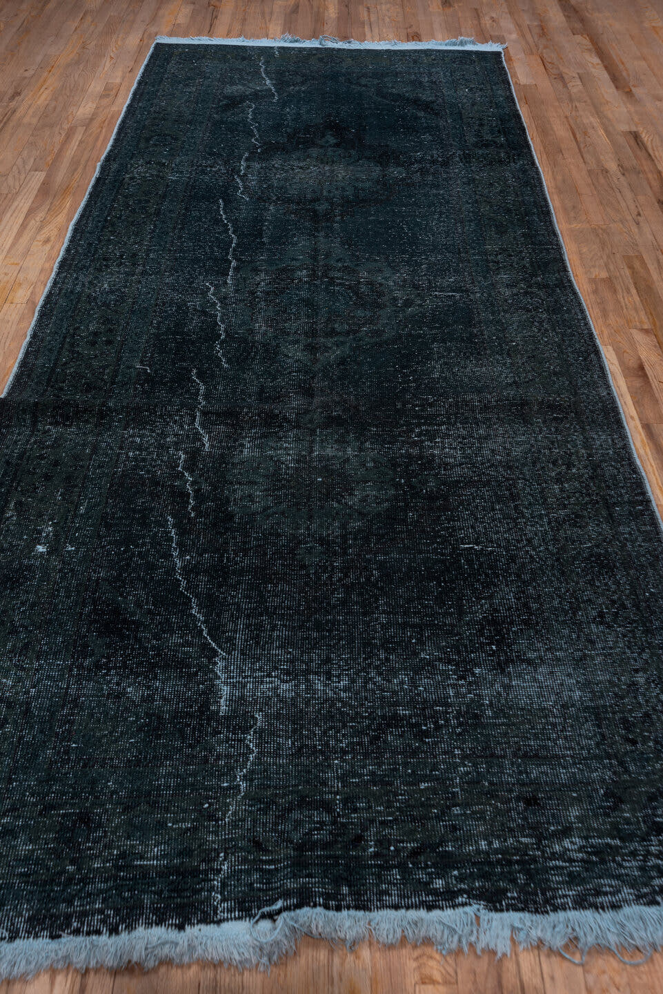 4' x 11' one-of-a-kind handmade vintage Overdyed runner rug. Color palette: charcoal, slate, blue, ivory, gray, black