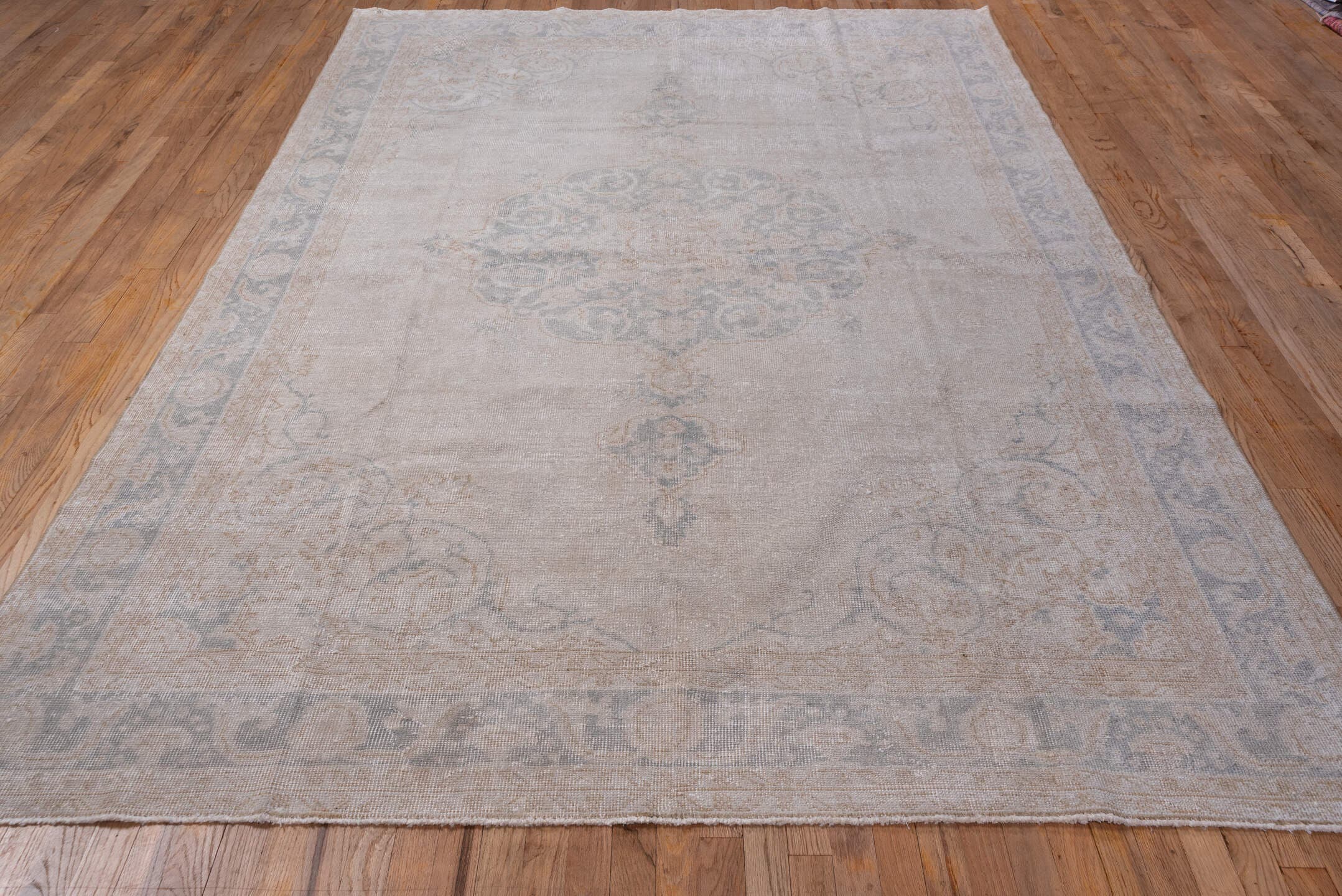 7' x 10' one-of-a-kind handmade vintage Oushak large size rug. Color palette: ivory, beige, taupe, pale blue, sand