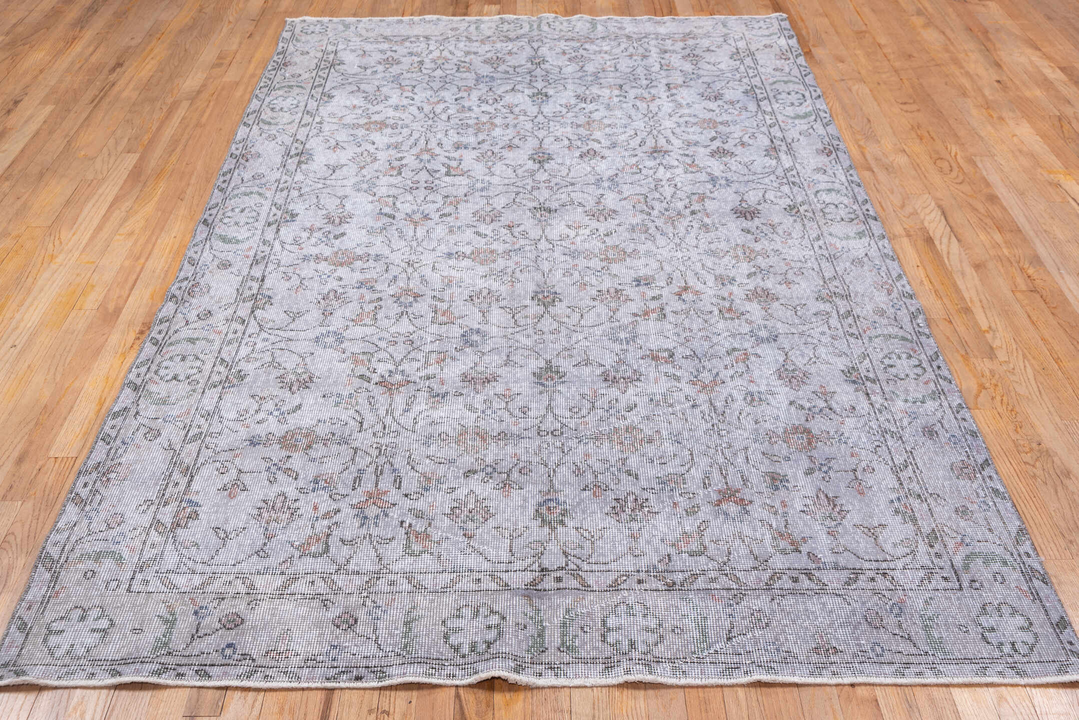 5' x 9' one-of-a-kind handmade antique Sparta medium size rug. Color palette: ivory, taupe, sage, rose, slate, beige, gray