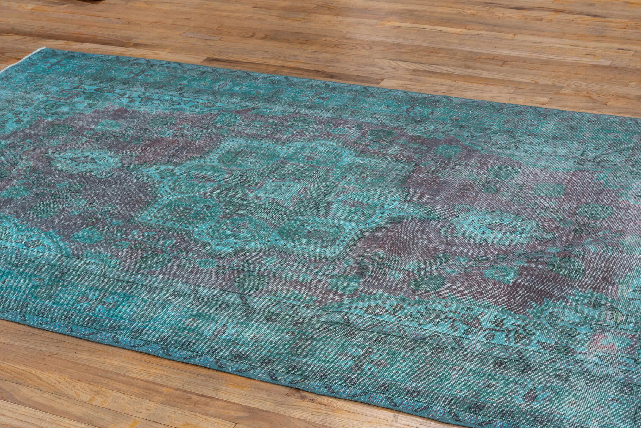 5' x 9' one-of-a-kind handmade antique Overdyed medium size rug. Color palette: turquoise, aqua, lavender, charcoal, teal