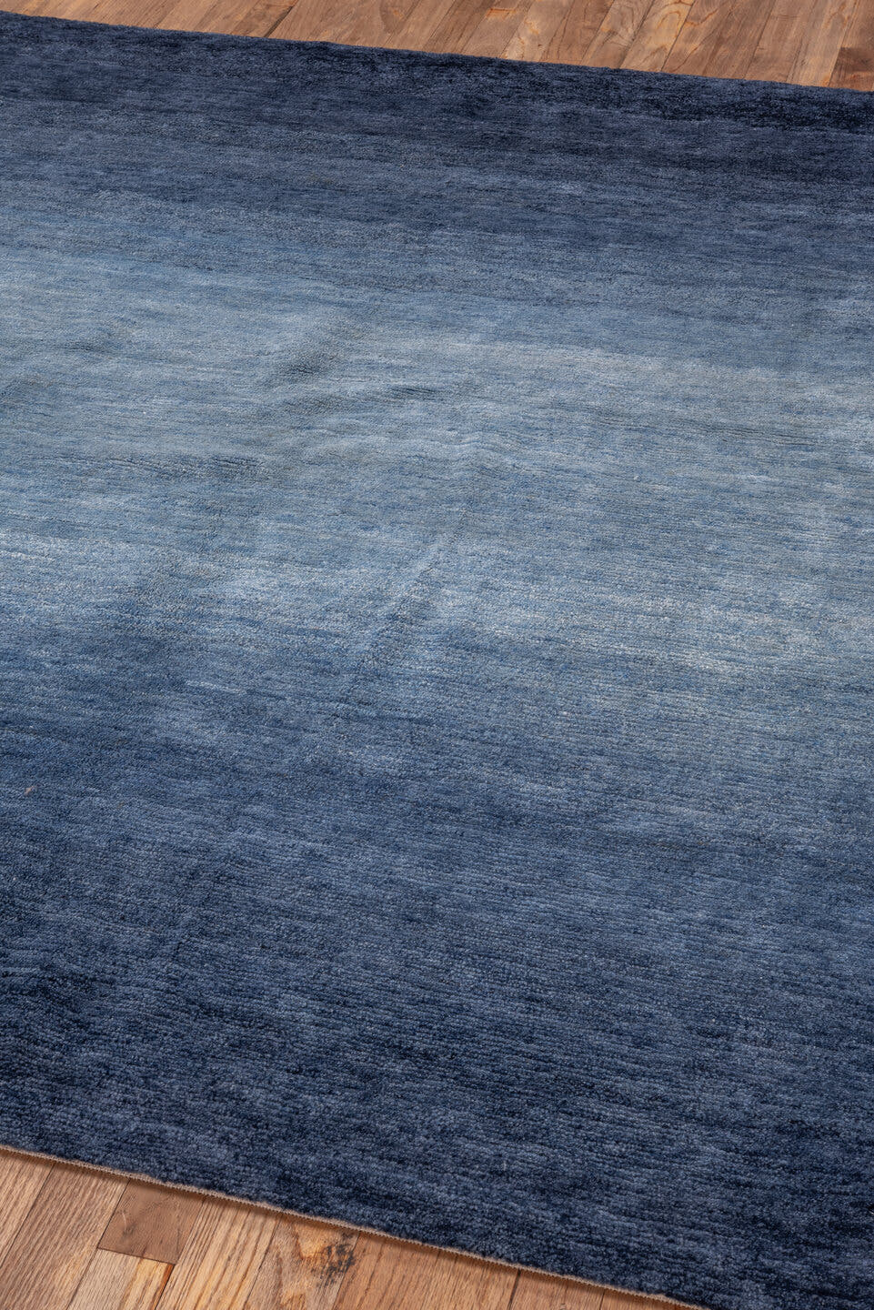 5' x 6' one-of-a-kind handmade vintage Tibetan rug. Color palette: blue, navy, slate, sky blue, gray, light blue