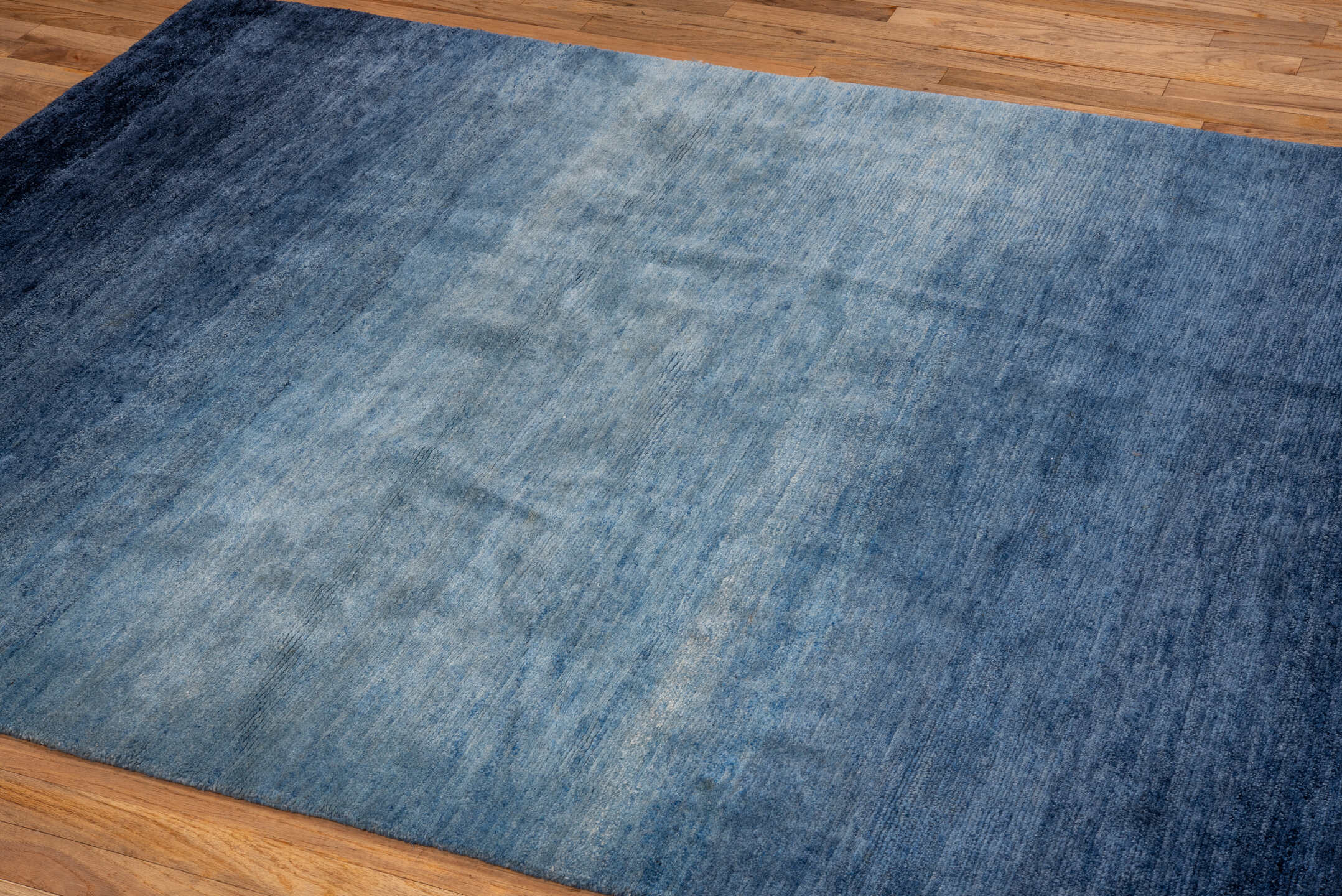 5' x 6' one-of-a-kind handmade vintage Tibetan rug. Color palette: blue, navy, slate, sky blue, gray, light blue