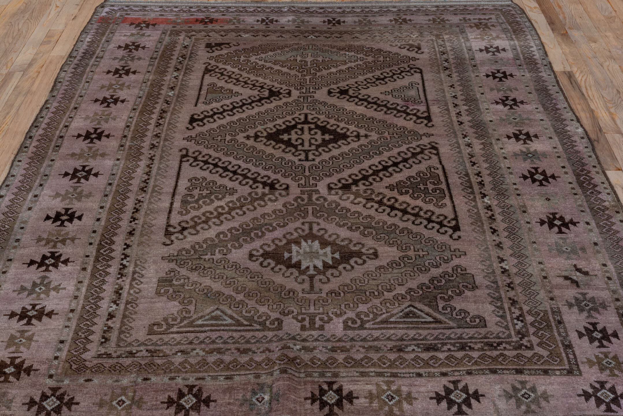 5' x 8' one-of-a-kind handmade antique Belouch medium size rug. Color palette: taupe, brown, charcoal, rose, rust, ivory