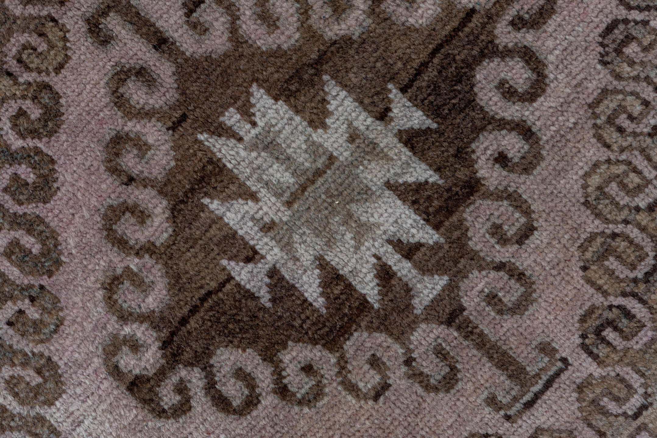 5' x 8' one-of-a-kind handmade vintage Belouch medium size rug. Color palette: brown, gray, light gray, pink