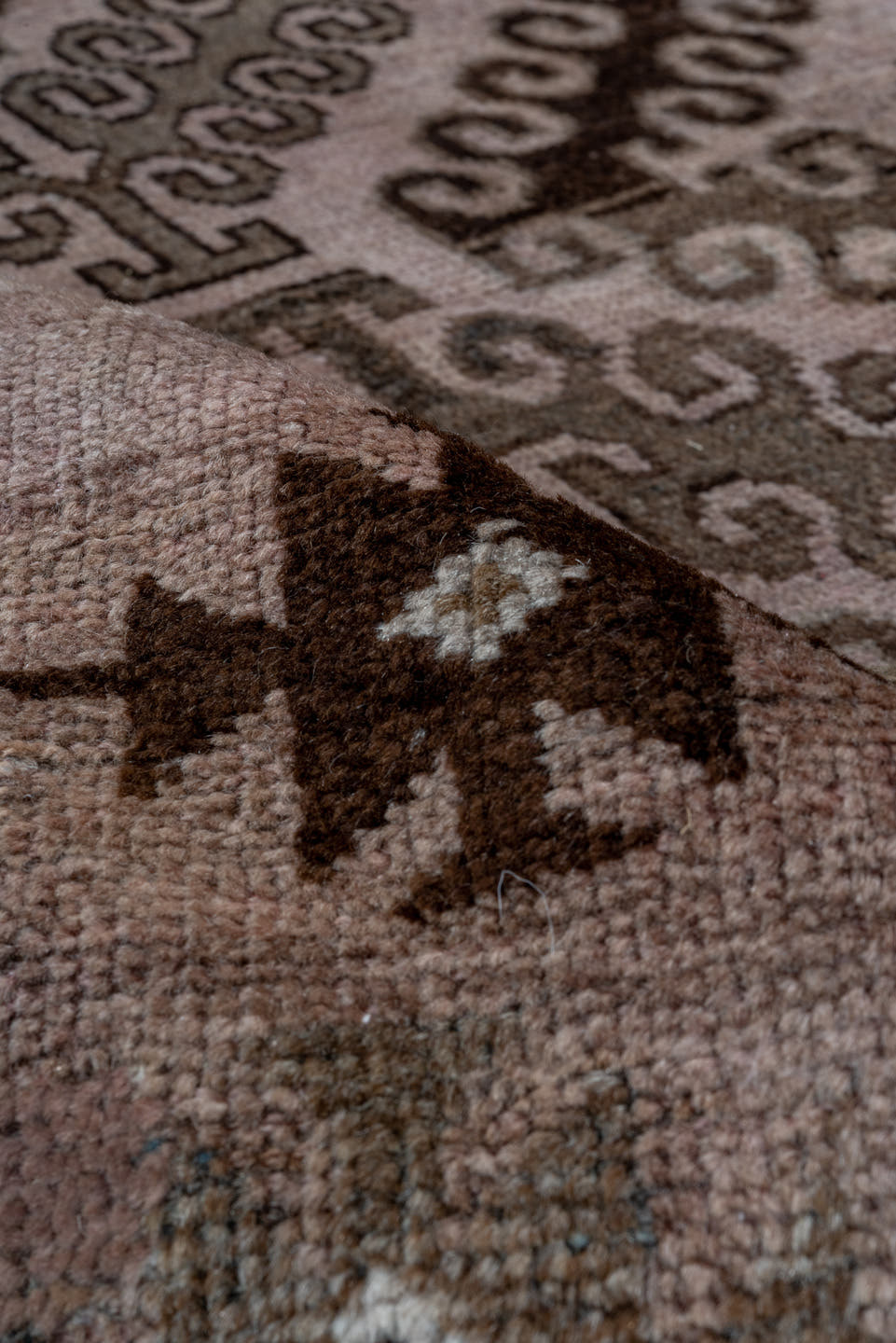 5' x 8' one-of-a-kind handmade antique Belouch medium size rug. Color palette: taupe, brown, charcoal, rose, rust, ivory