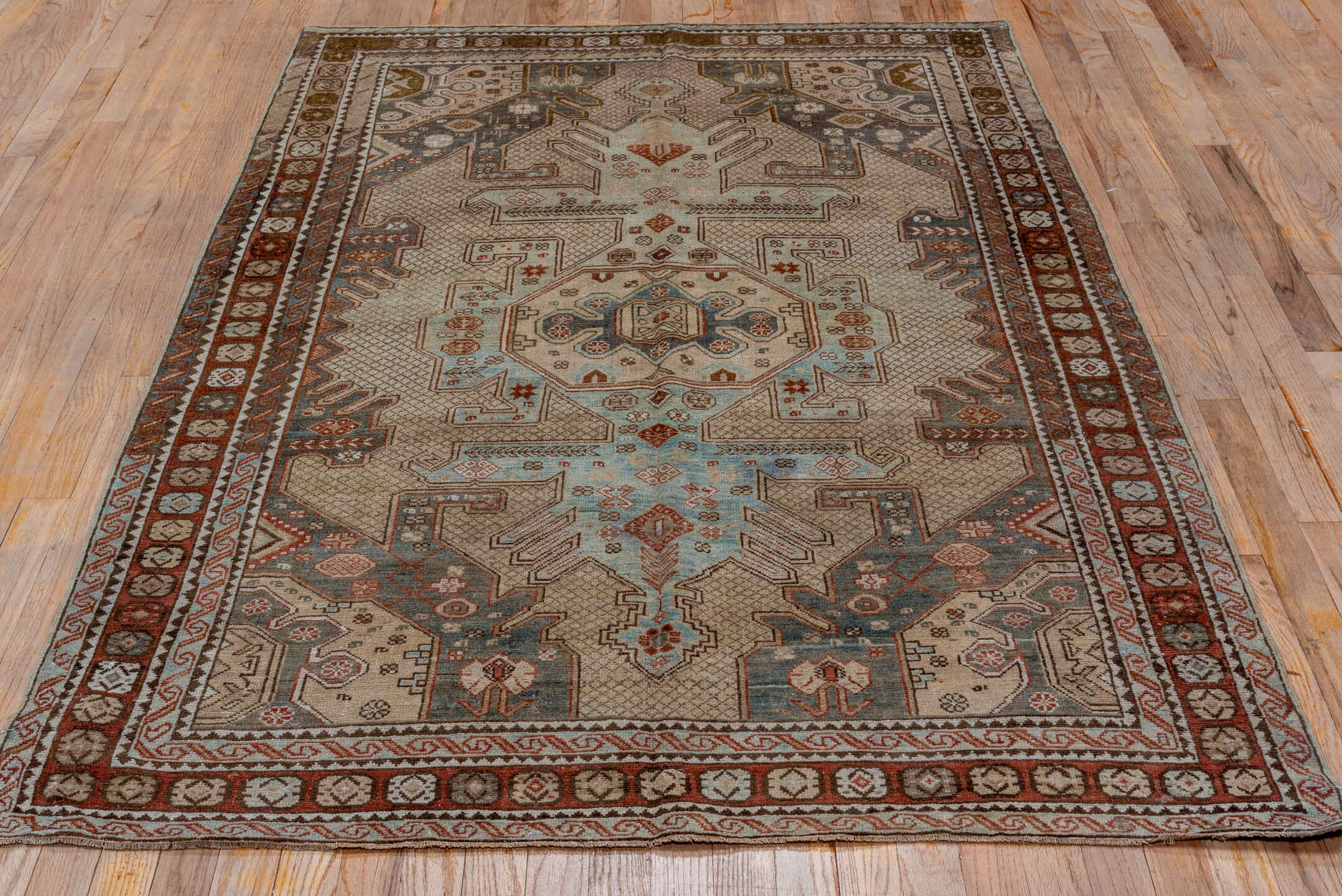 4' x 7' one-of-a-kind handmade antique Shirvan rug. Color palette: ivory, rust, brown, slate, sky blue, taupe, terracotta