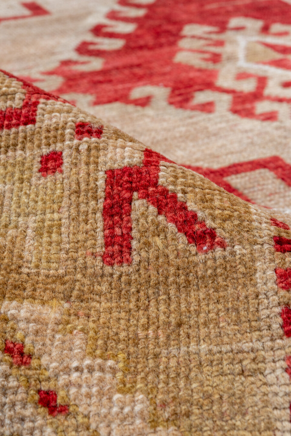 4' x 7' one-of-a-kind handmade vintage Caucasian rug. Color palette: brown, gray, light gray, off-white, pink, red