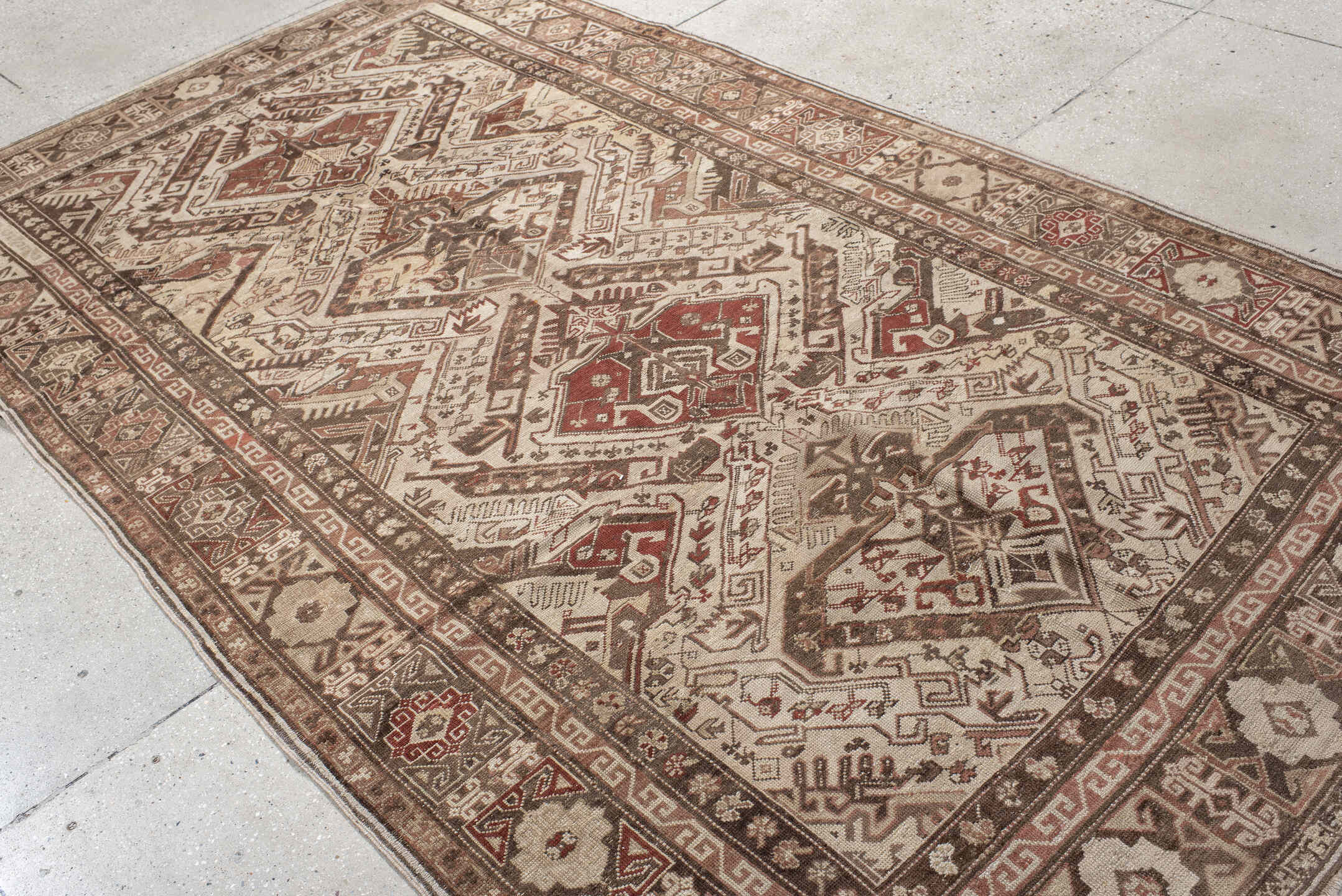 5' x 10' one-of-a-kind handmade vintage Caucasian medium size rug. Color palette: ivory, taupe, brown, rust, camel, rose