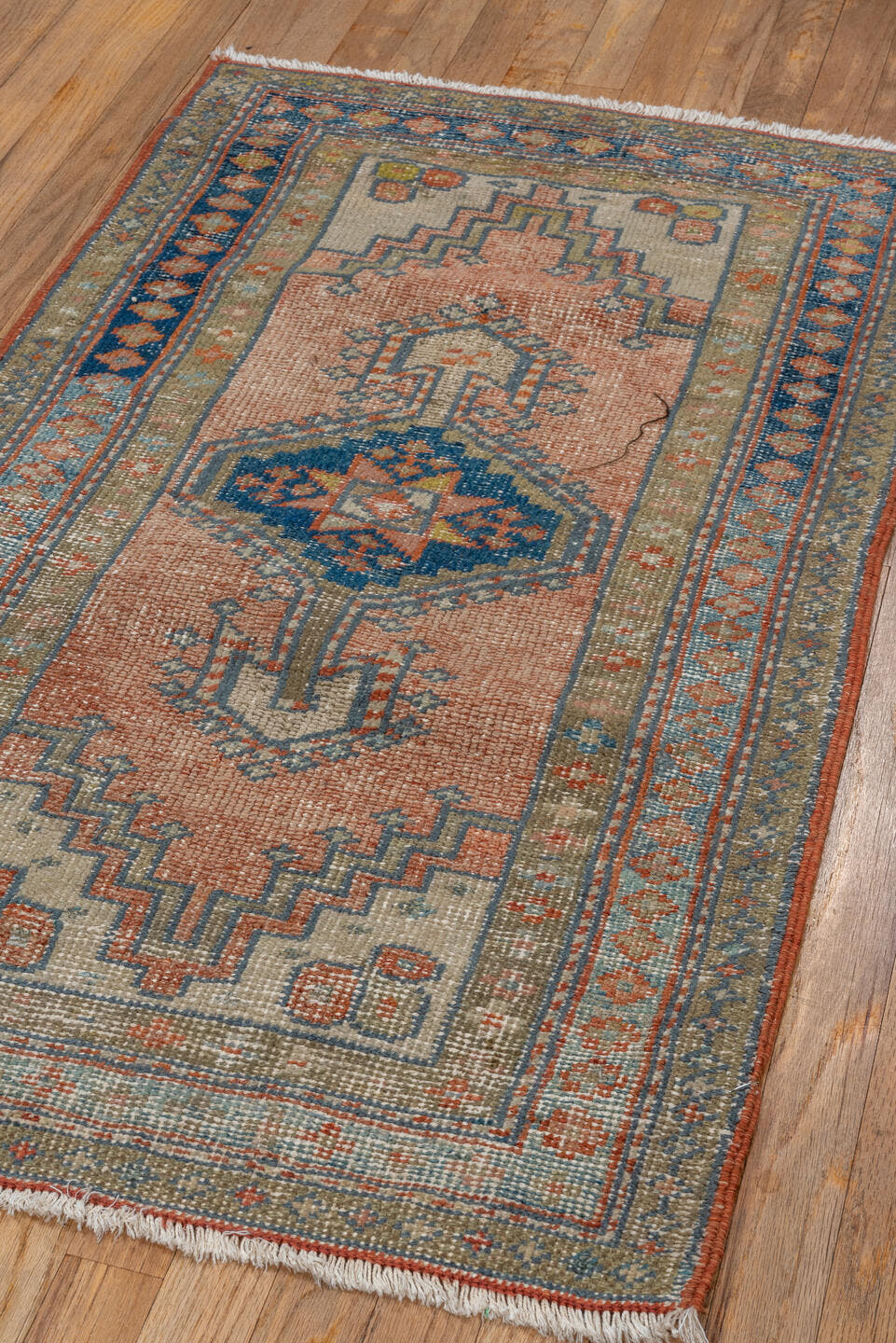 2' x 4' one-of-a-kind handmade antique Heriz small size rug. Color palette: ivory, faded coral, slate blue, indigo, taupe