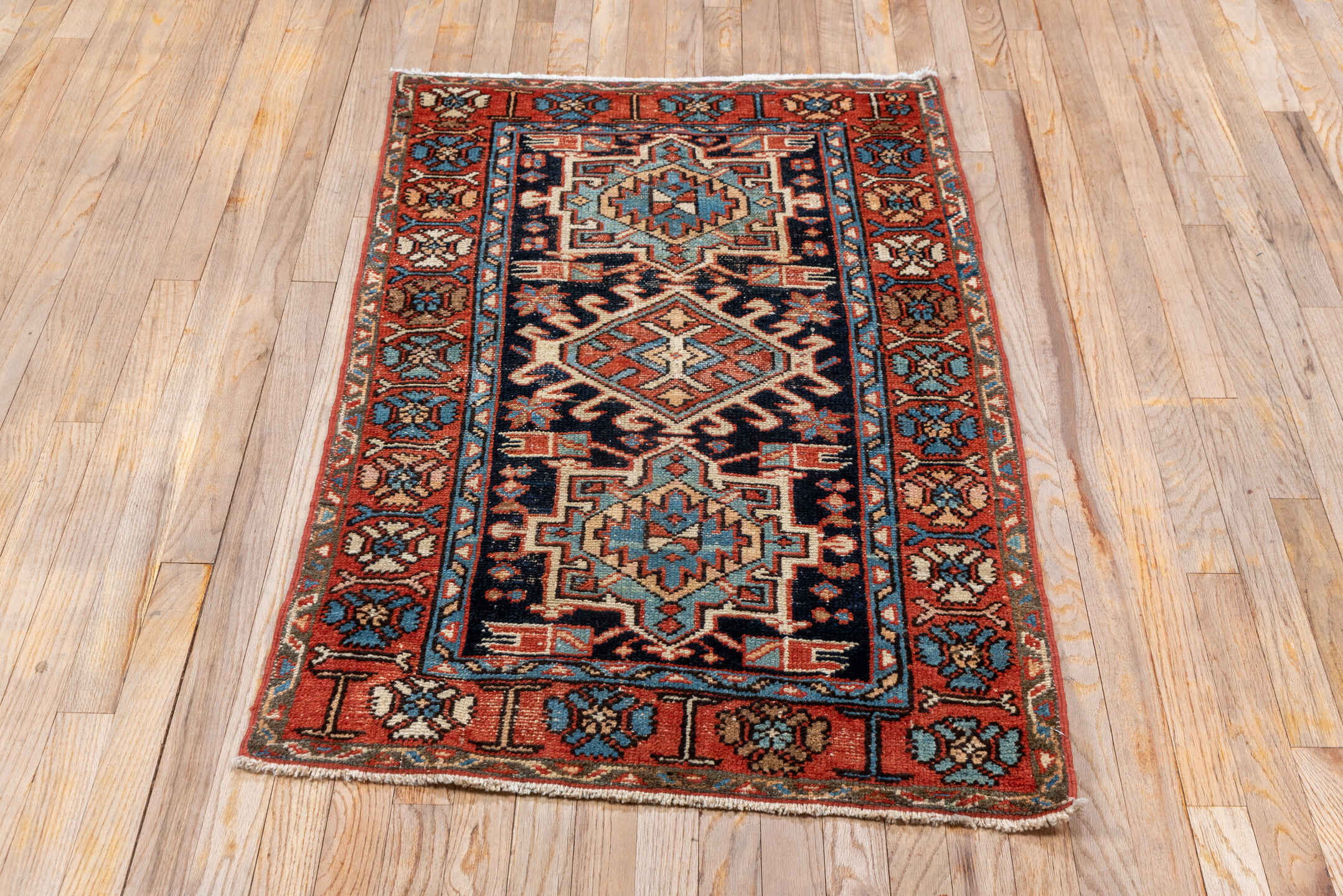 2' x 4' one-of-a-kind handmade vintage Karaje small size rug. Color palette: blue, brown, gray, pink, red