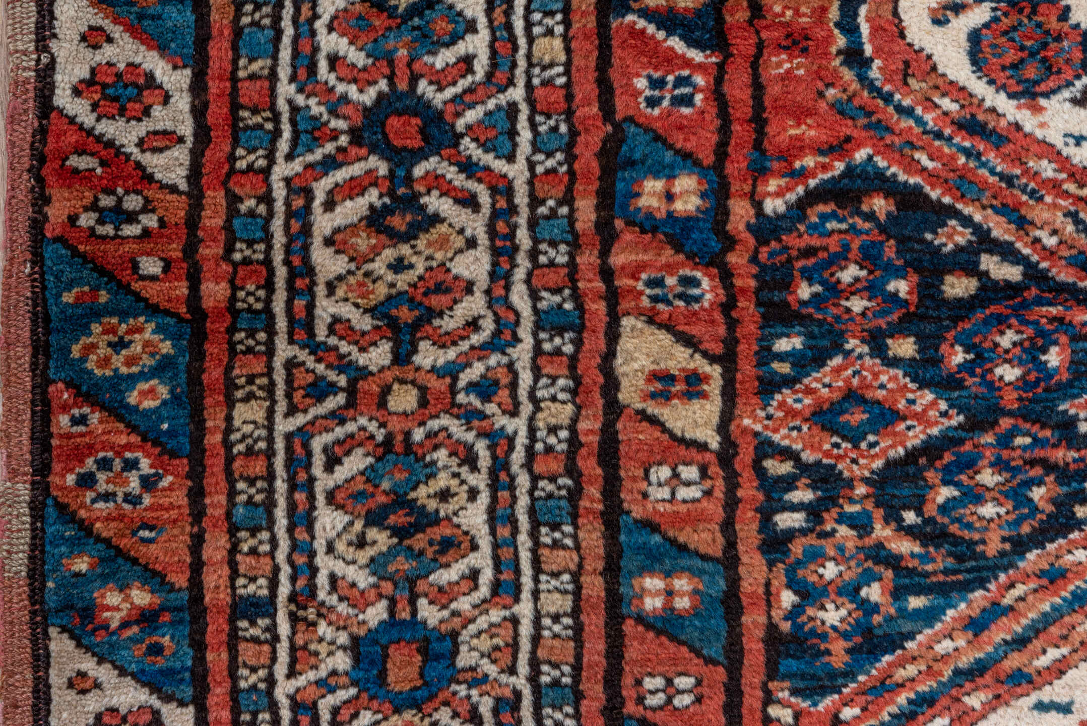 3' x 9' one-of-a-kind handmade antique NW Persian runner rug. Color palette: rust, indigo, ivory, navy, terra cotta, camel