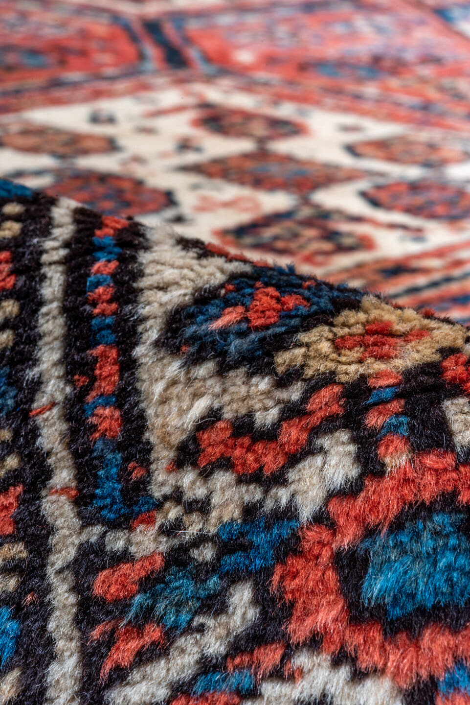 3' x 9' one-of-a-kind handmade antique NW Persian runner rug. Color palette: rust, indigo, ivory, navy, terra cotta, camel