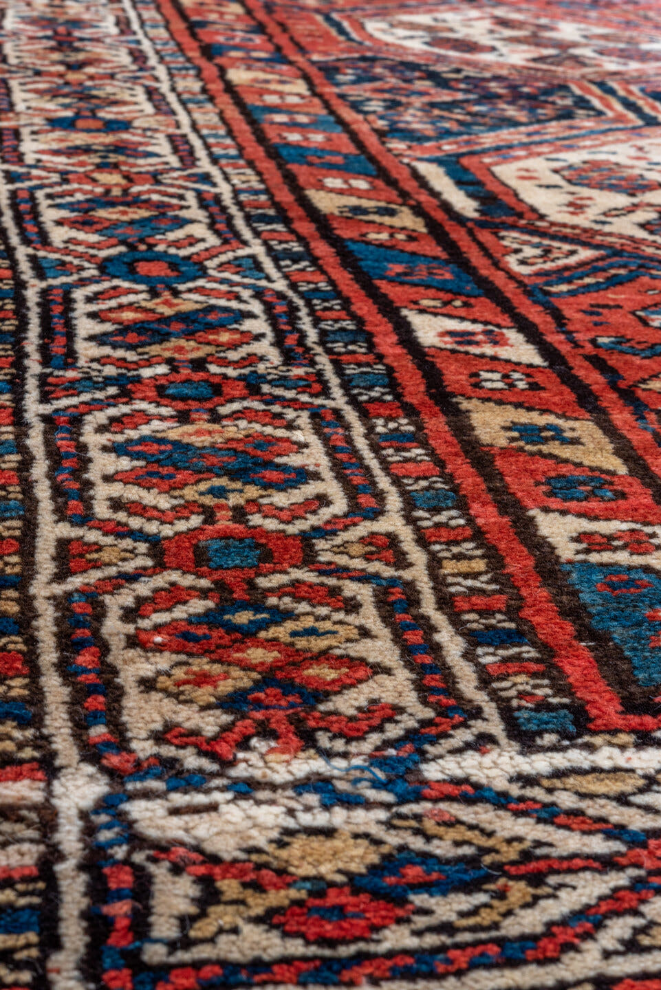 3' x 9' one-of-a-kind handmade antique NW Persian runner rug. Color palette: rust, indigo, ivory, navy, terra cotta, camel