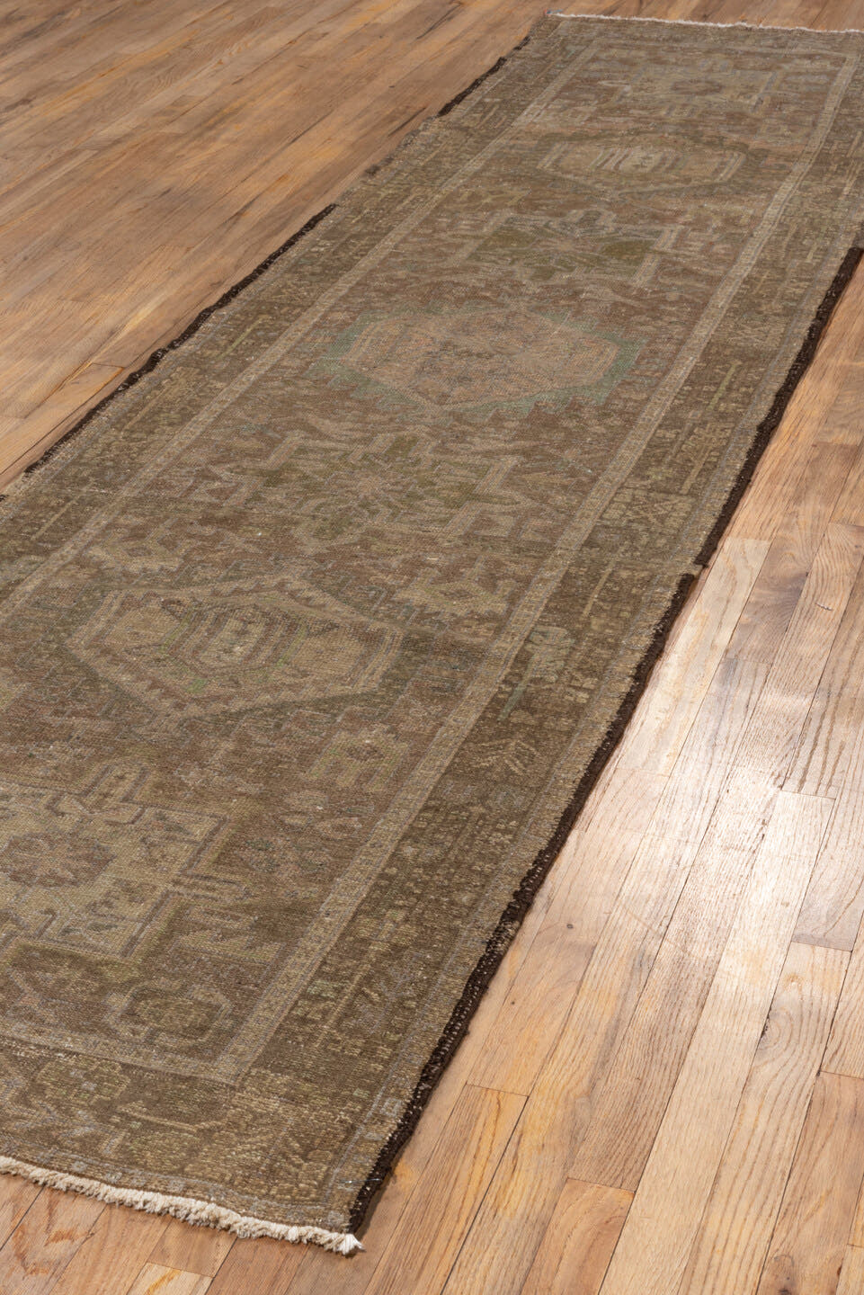 3' x 12' one-of-a-kind handmade antique Karaje runner rug. Color palette: taupe, brown, camel, sage, ivory, olive, charcoal