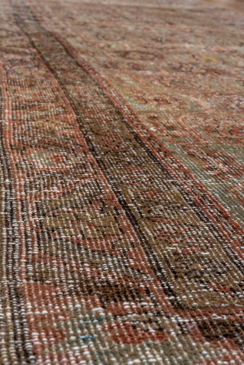 3' x 11' one-of-a-kind handmade antique Sarab runner rug. Color palette: taupe, terra cotta, brown, faded blue, rust, ivory