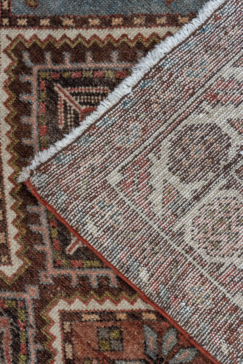 5' x 10' one-of-a-kind handmade antique Baktiary medium size rug. Color palette: rust, ivory, sky blue, brown, burgundy