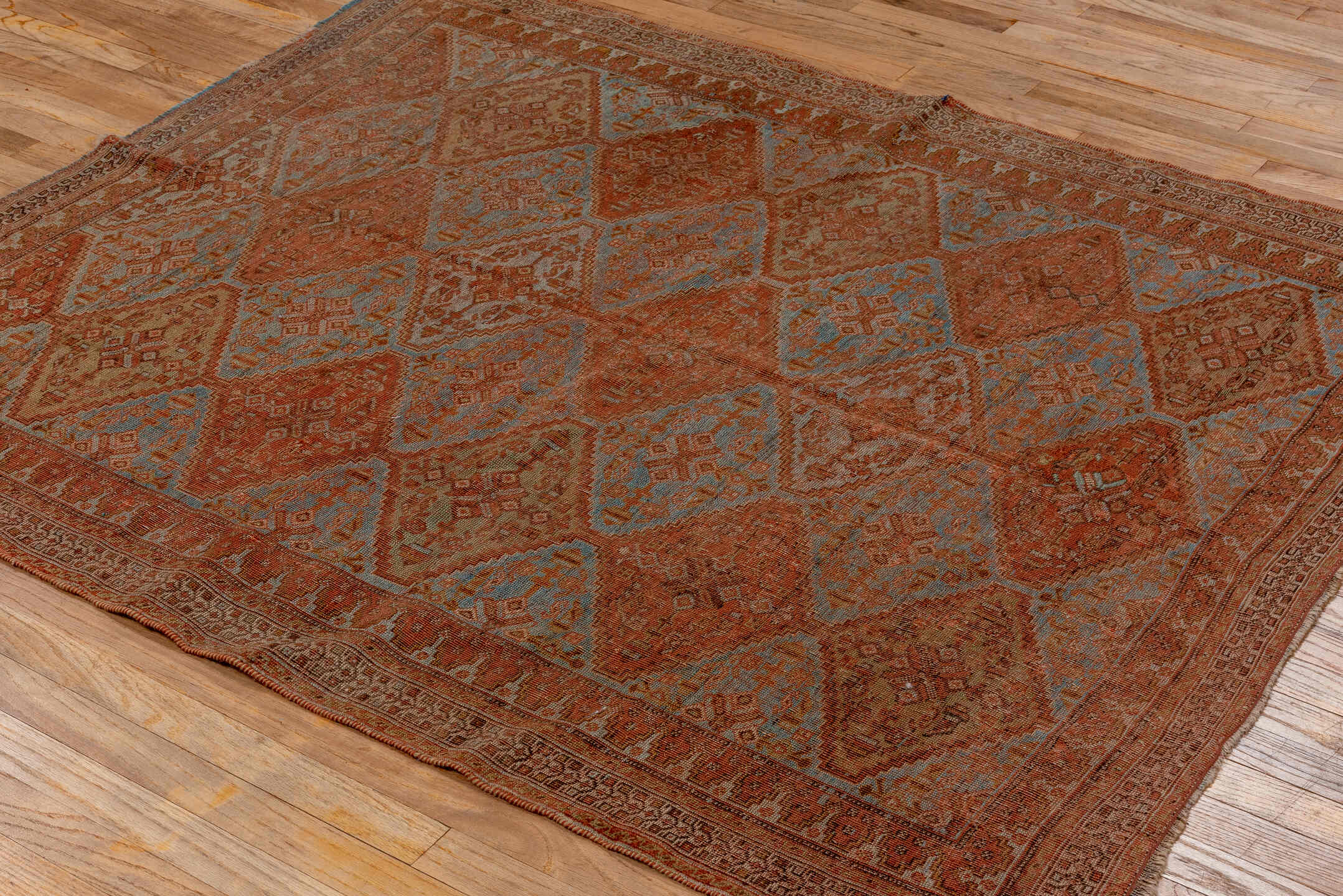 4' x 5' one-of-a-kind handmade antique Afshar small size rug. Color palette: rust, terra cotta, pale blue, ivory, camel
