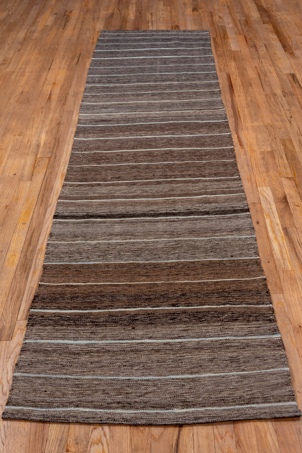 2' x 11' one-of-a-kind handmade vintage Kilim runner rug. Color palette: taupe, brown, ivory, camel, greige, beige, gray
