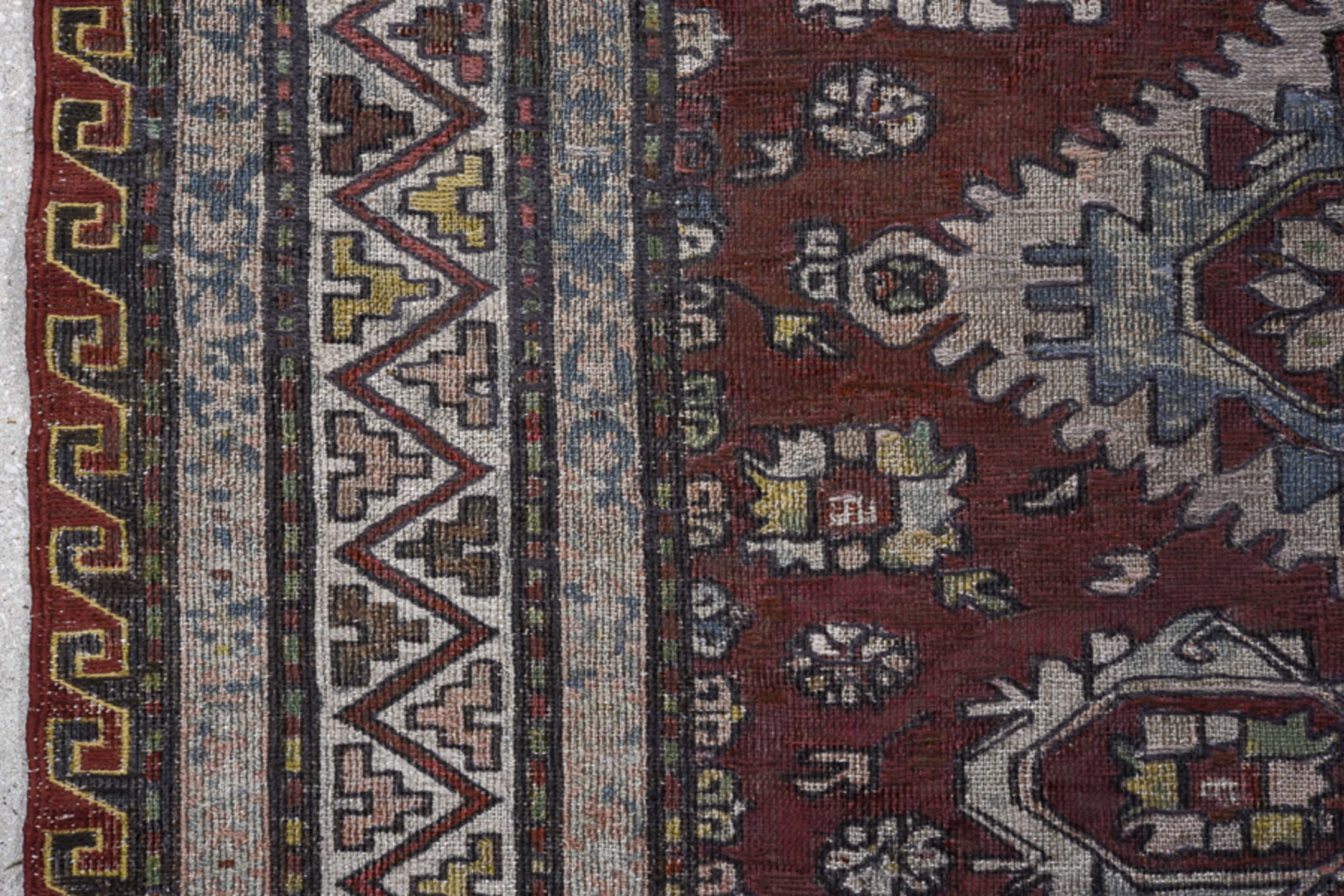 7' x 9' one-of-a-kind handmade vintage Sumak rug. Color palette: black, blue, brown, dark gray, dim gray, gray, light gray