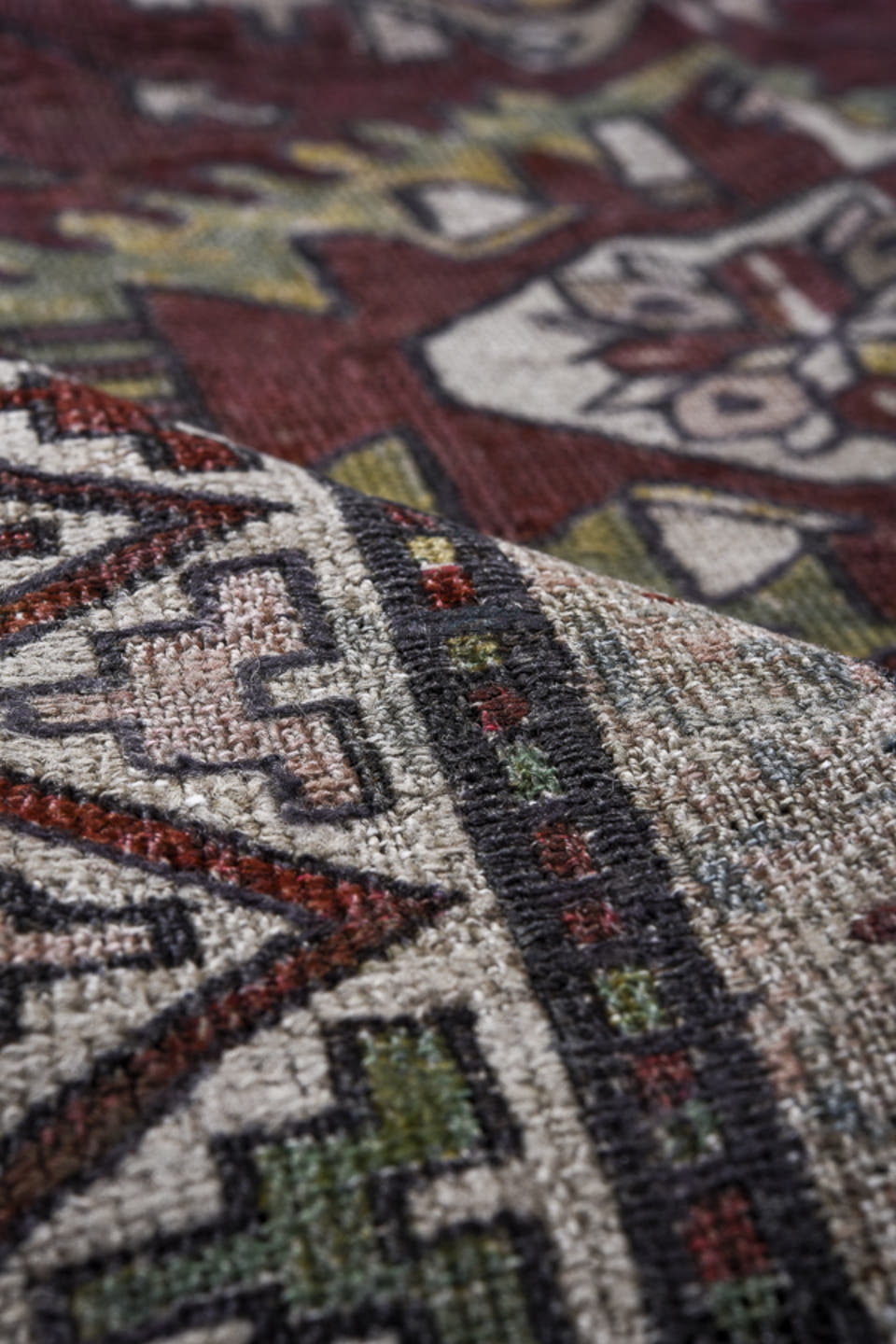 7' x 9' one-of-a-kind handmade antique Sumak rug. Color palette: rust, ivory, slate, sage, gold, charcoal, camel, terracotta