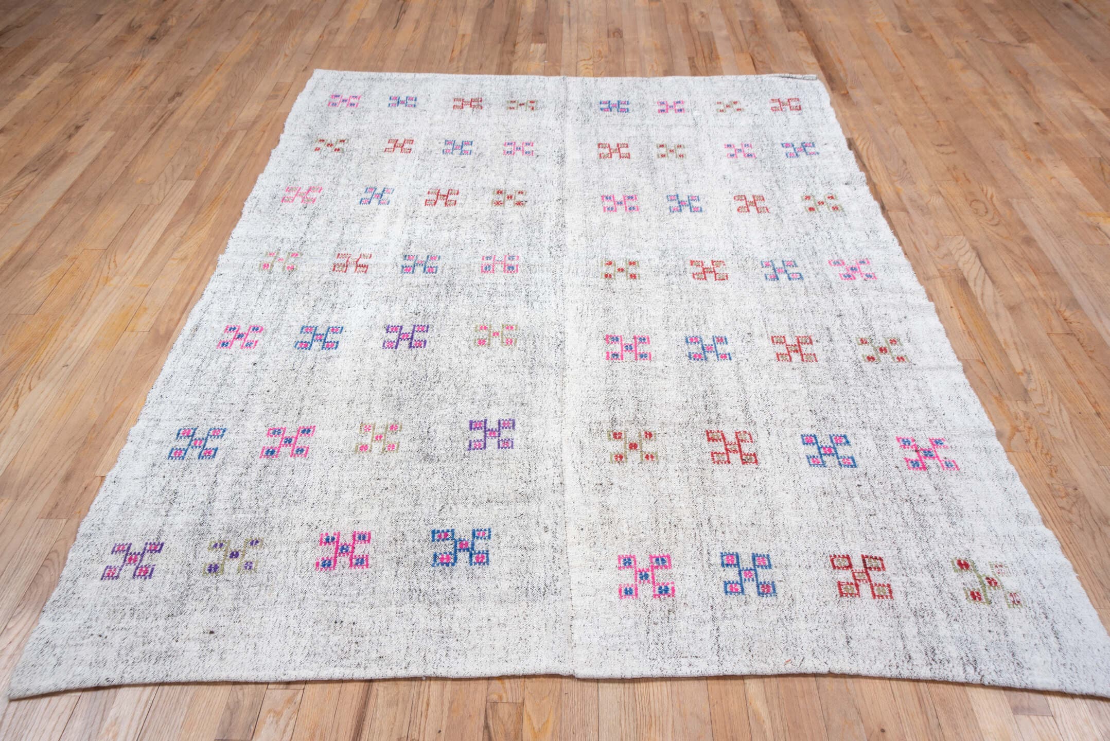 5' x 8' one-of-a-kind handmade antique Flatweave medium size rug. Color palette: ivory, pink, blue, rust, lavender, taupe