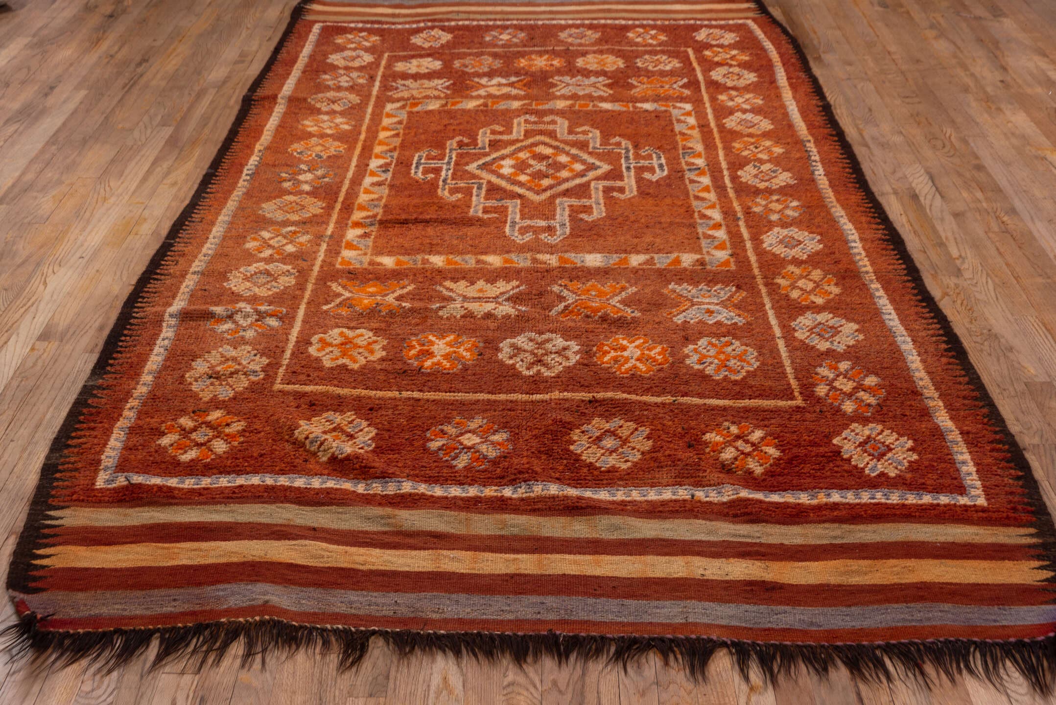 5' x 12' one-of-a-kind handmade vintage Moroccan rug. Color palette: rust, terra cotta, ivory, brown, camel, slate