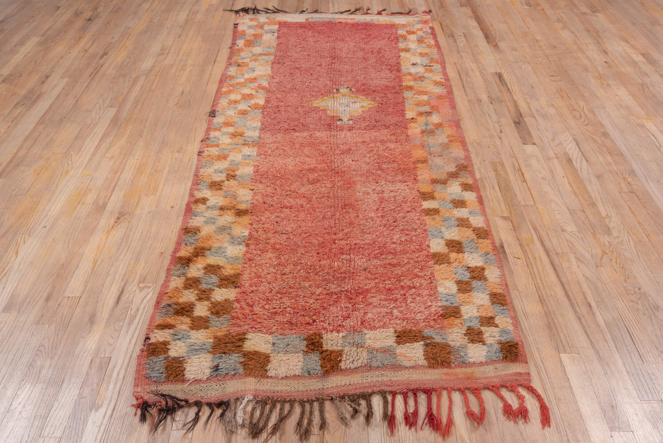 3' x 9' one-of-a-kind handmade vintage Moroccan runner rug. Color palette: brown, orange, pink, red