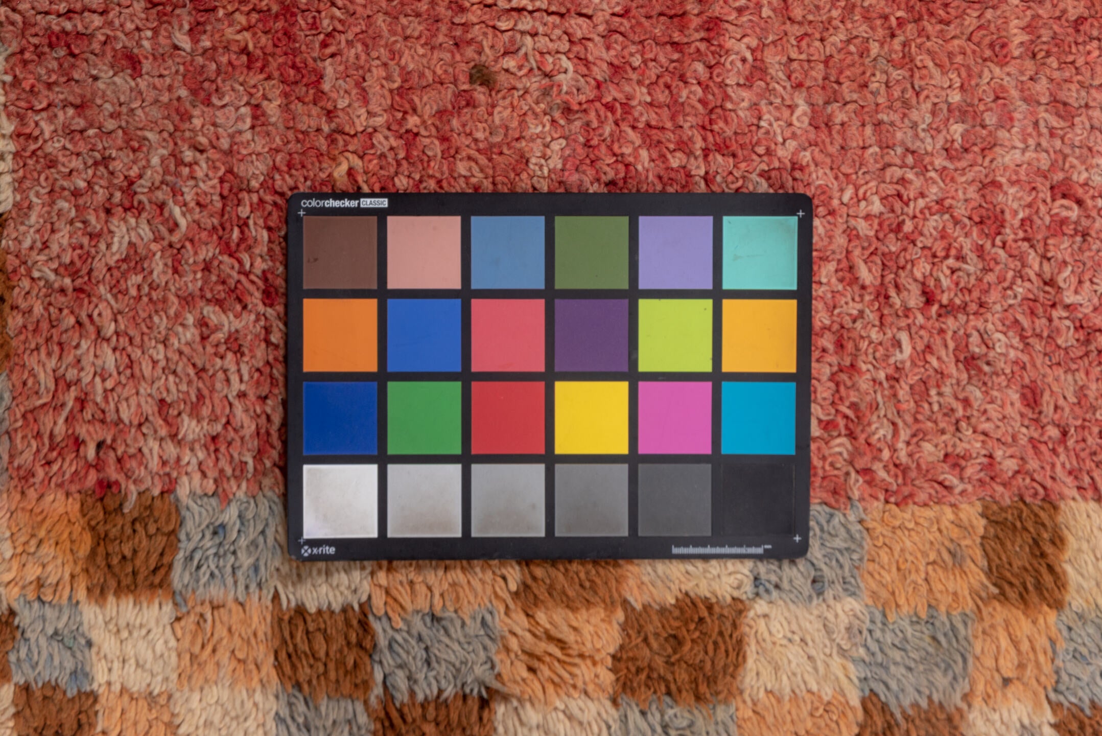 3' x 9' one-of-a-kind handmade vintage Moroccan runner rug. Color palette: brown, orange, pink, red