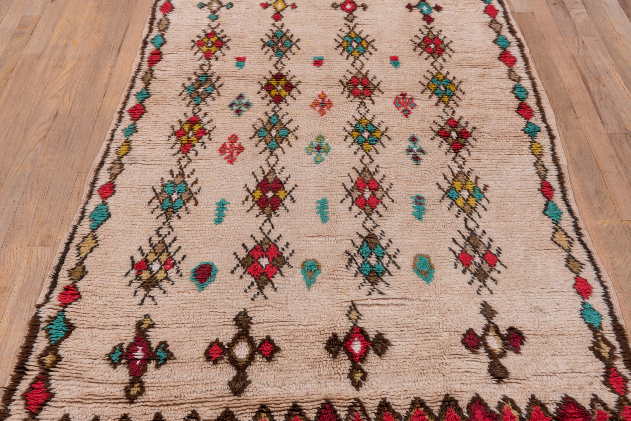 3' x 7' one-of-a-kind handmade vintage Moroccan rug. Color palette: ivory, crimson, turquoise, brown, gold, taupe, red, teal