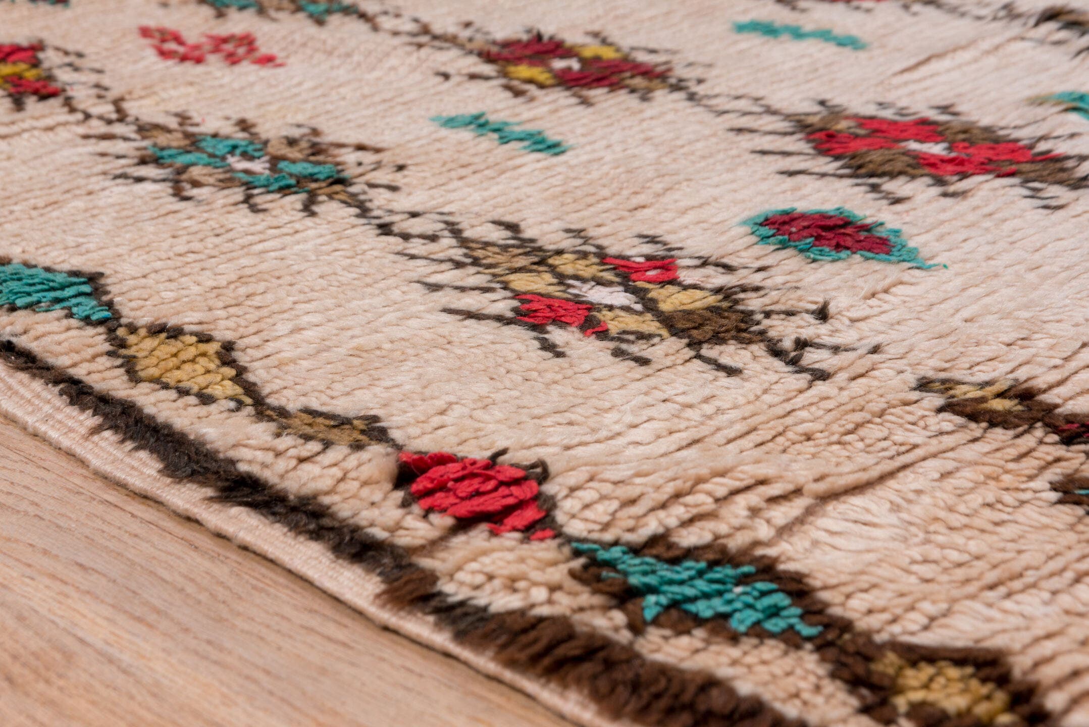3' x 7' one-of-a-kind handmade vintage Moroccan rug. Color palette: ivory, crimson, turquoise, brown, gold, taupe, red, teal