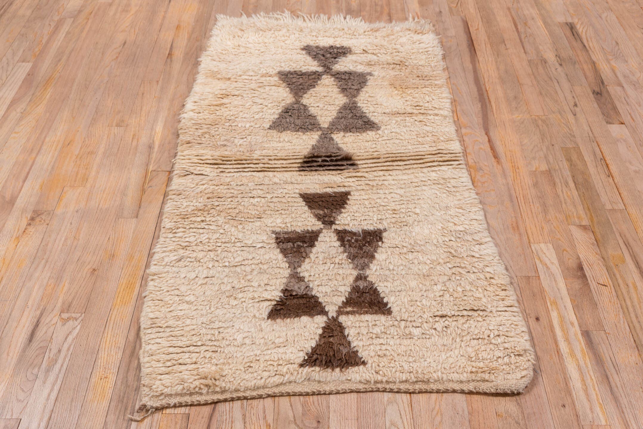 2' x 5' one-of-a-kind handmade vintage Moroccan small size rug. Color palette: ivory, brown, taupe, camel, beige, gray