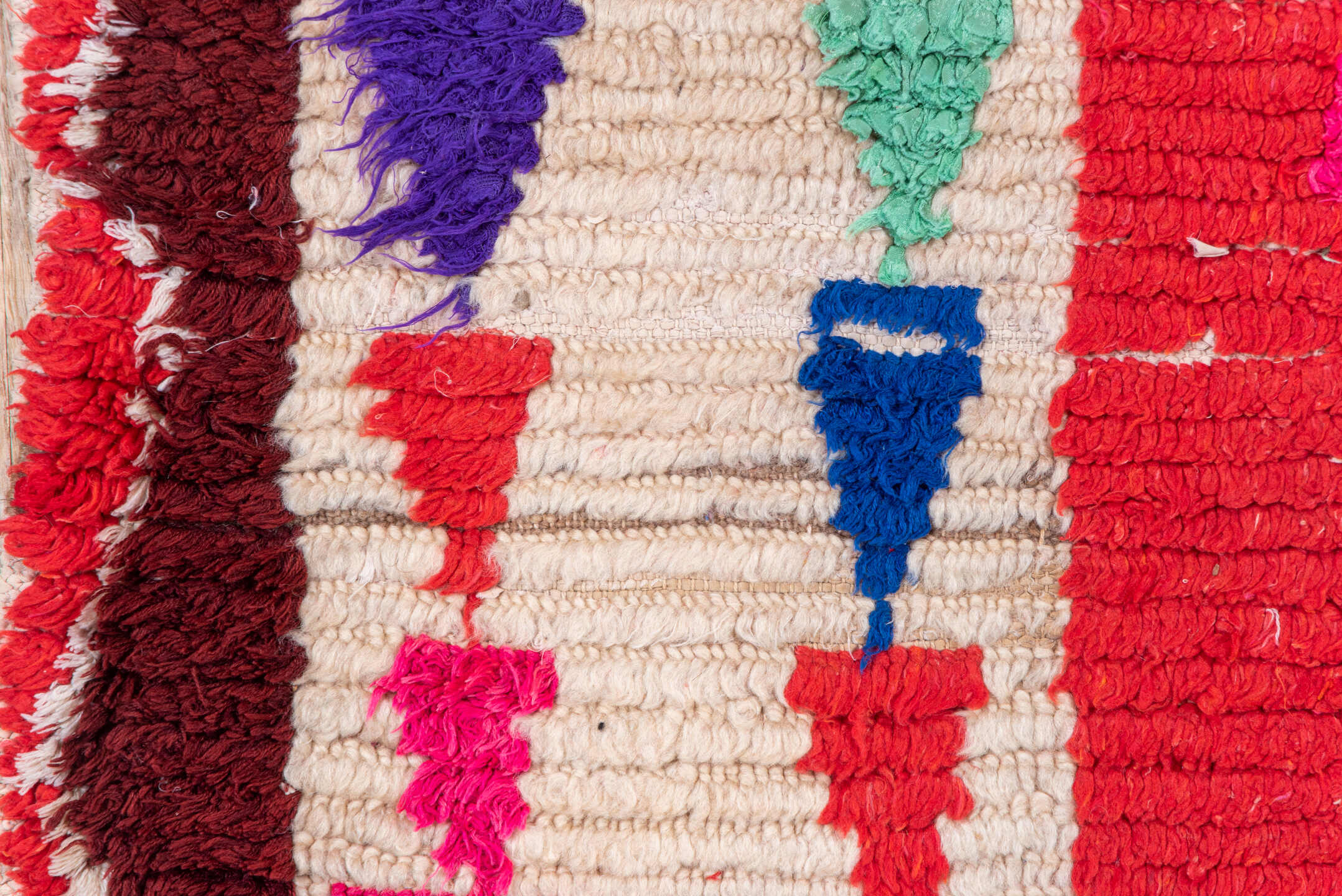 4' x 5' one-of-a-kind handmade vintage Moroccan small size rug. Color palette: red, ivory, black, fuchsia, turquoise