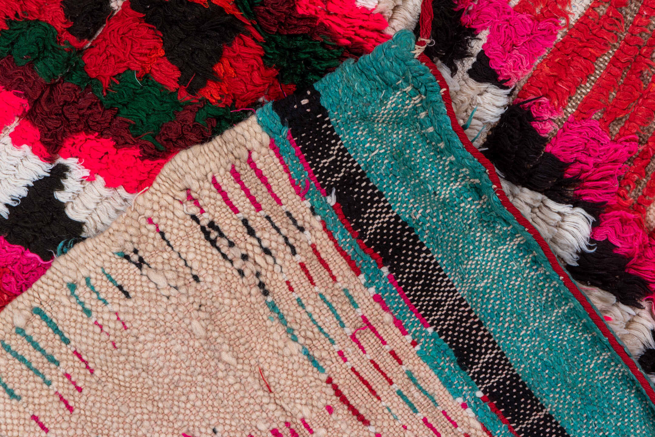 4' x 5' one-of-a-kind handmade vintage Moroccan small size rug. Color palette: red, ivory, black, fuchsia, turquoise