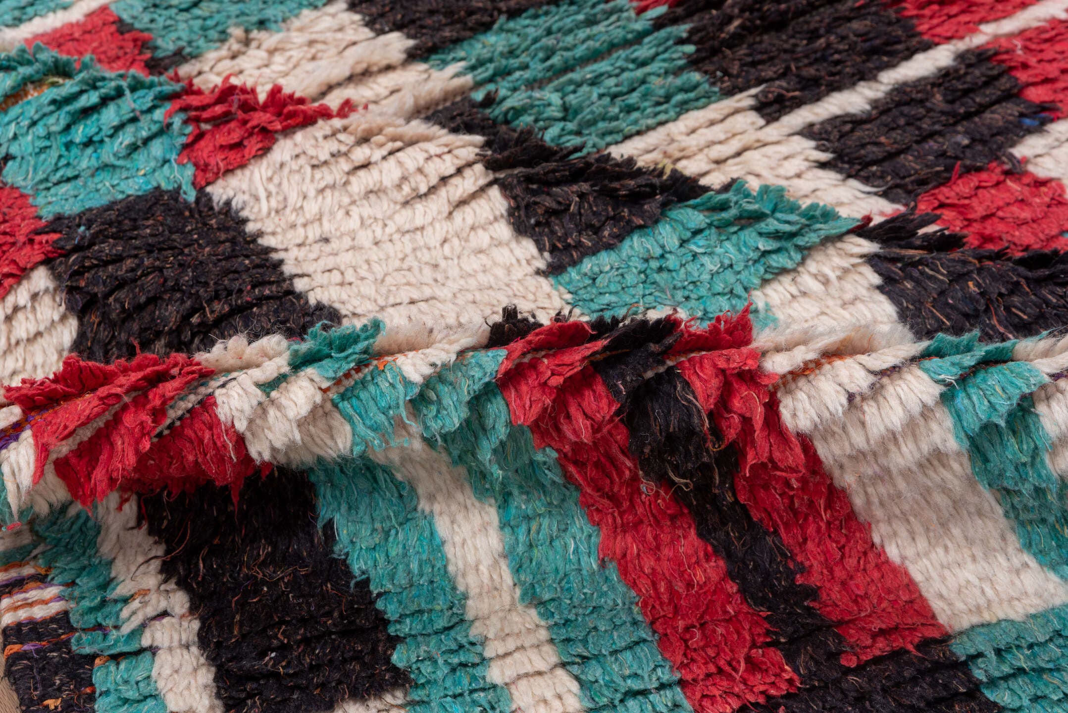 4' x 6' one-of-a-kind handmade vintage Moroccan small size rug. Color palette: ivory, turquoise, crimson, charcoal, rose