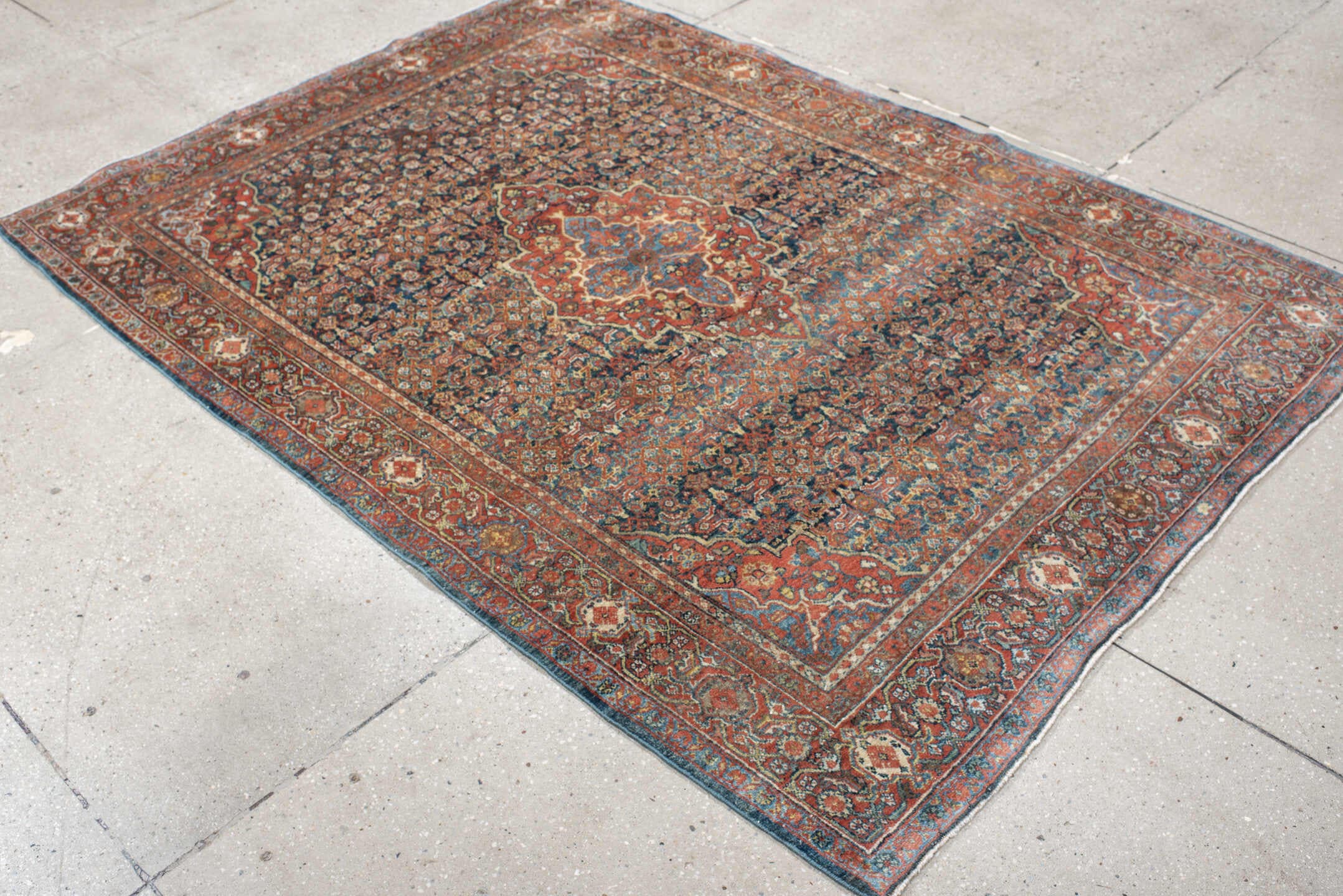 4' x 6' one-of-a-kind handmade antique Sarouk small size rug. Color palette: rust, navy, sky_blue, ivory, olive, coral