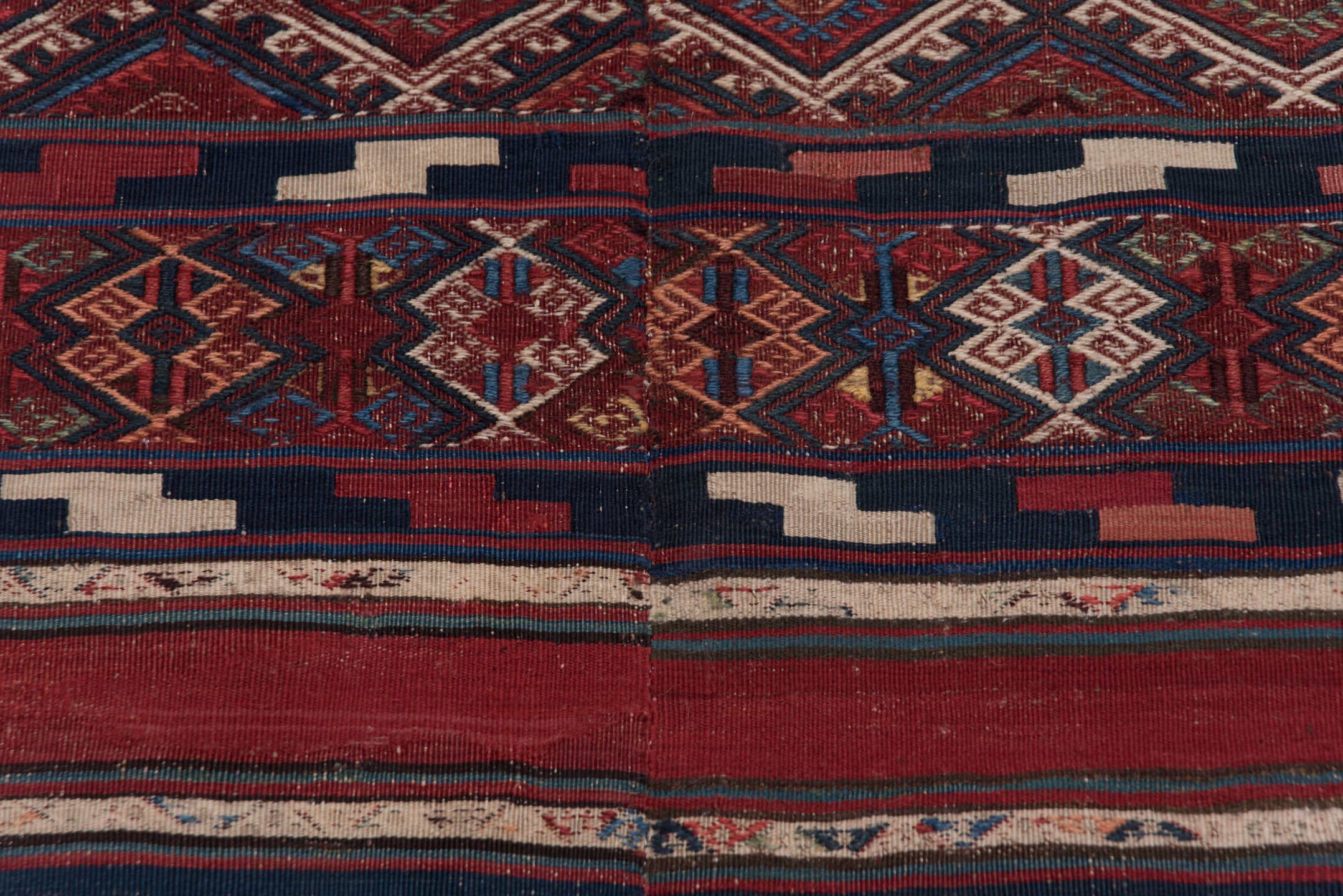 5' x 15' one-of-a-kind handmade antique Kilim rug. Color palette: rust, indigo, burgundy, ivory, navy, sienna, camel