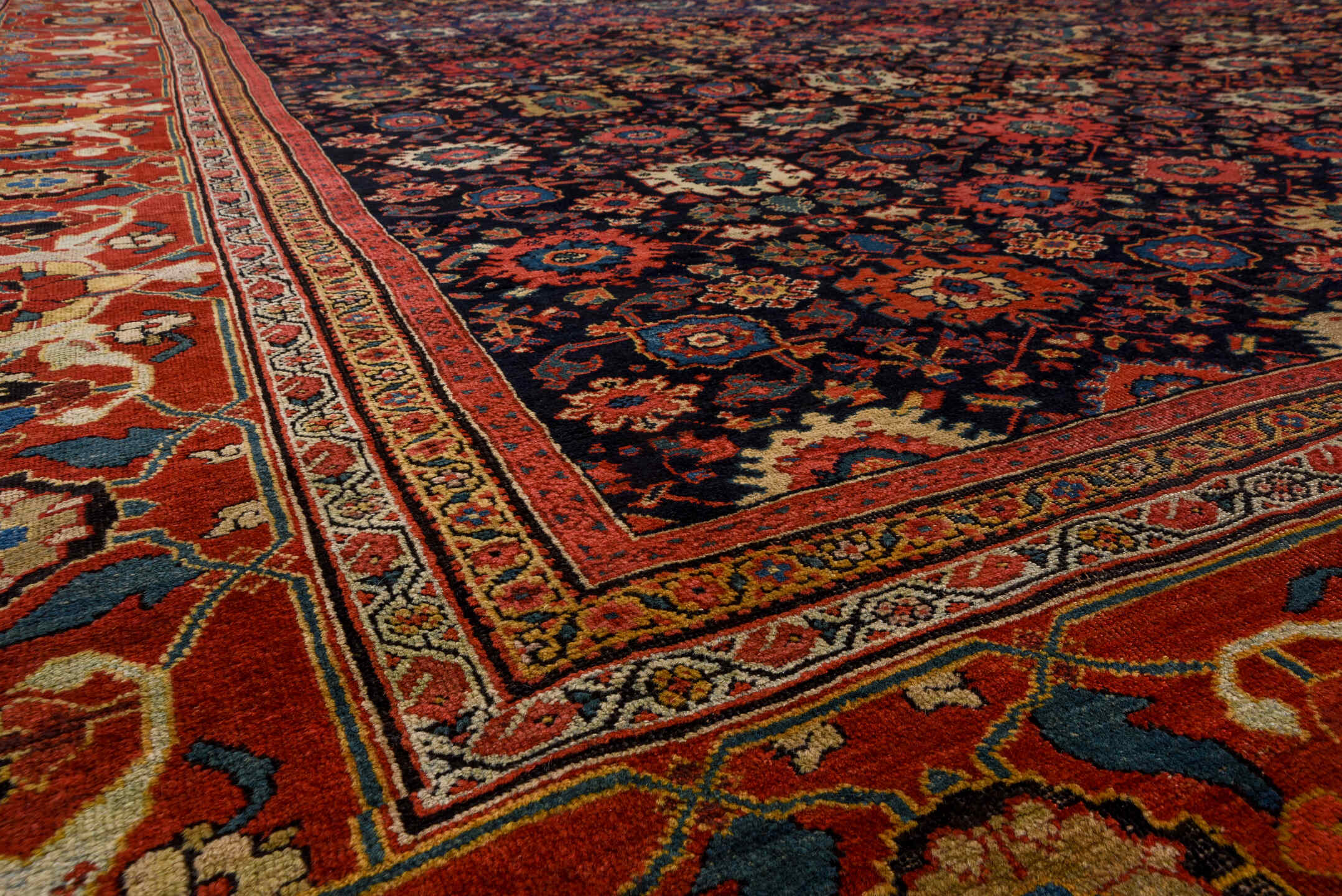 14' x 19' one-of-a-kind handmade antique Sultanabad oversize rug. Color palette: navy, rust, ivory, sky blue, terra cotta