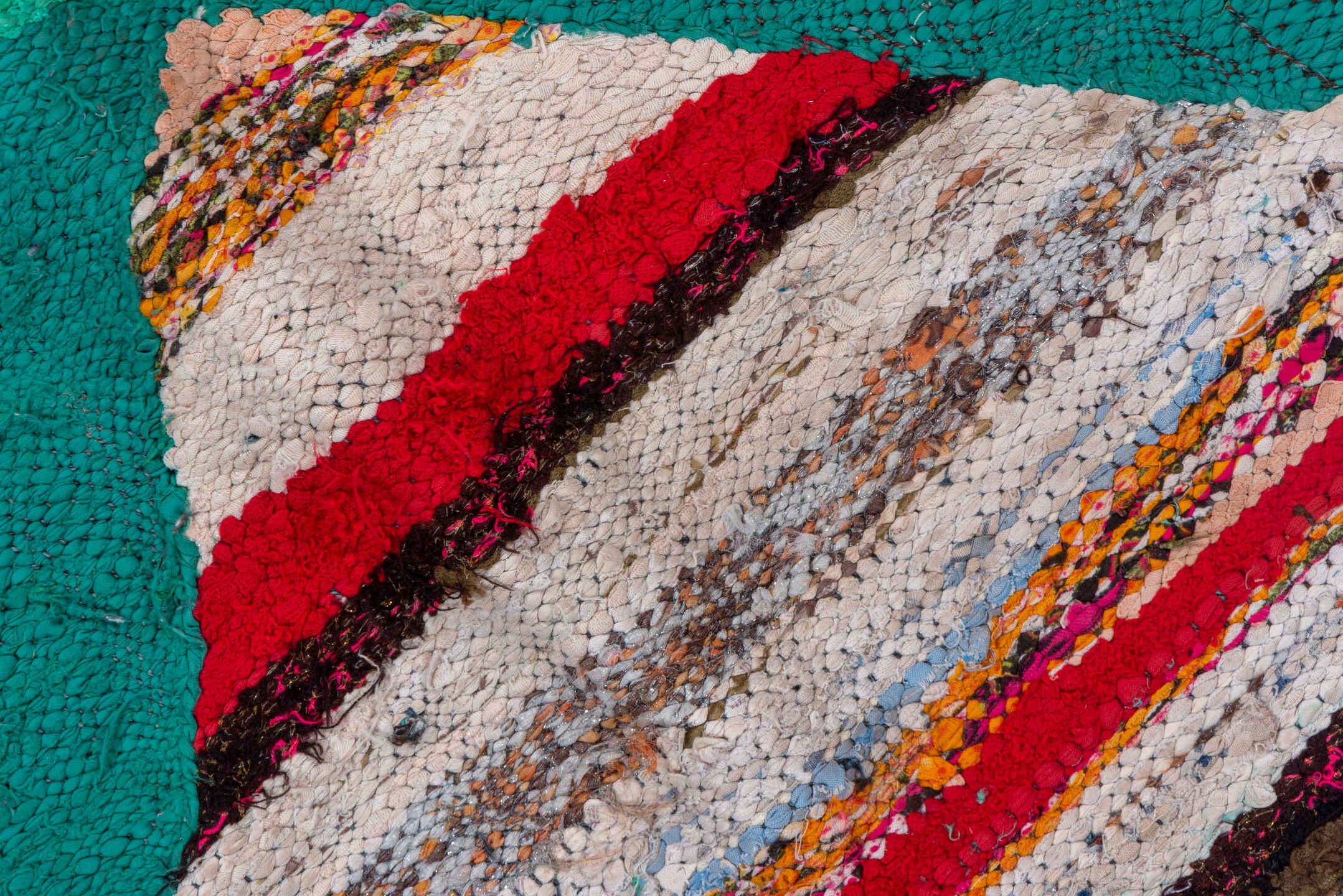 5' x 8' one-of-a-kind handmade vintage Rag Rug medium size rug. Color palette: ivory, black, teal, red, sky_blue, violet