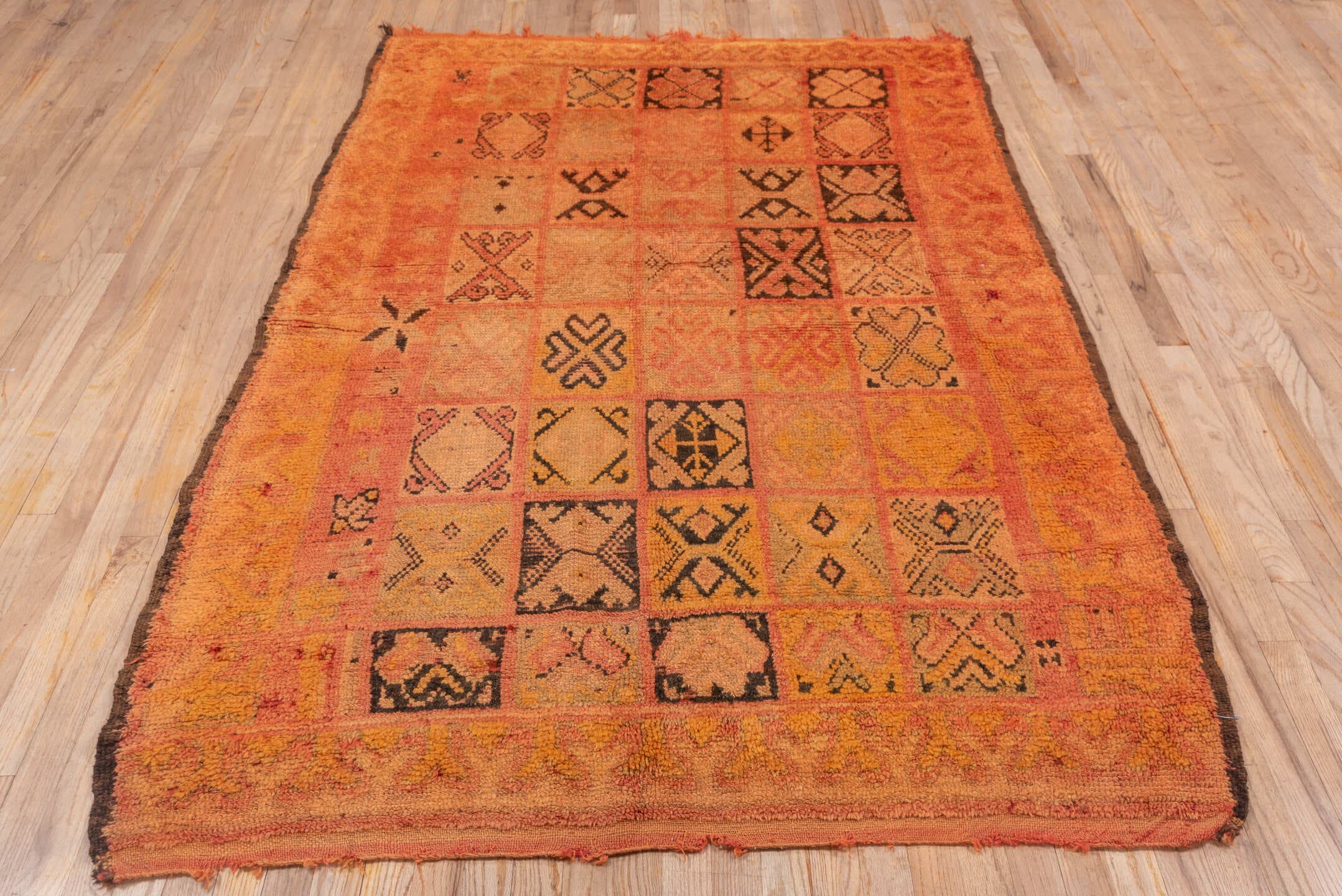 4' x 7' one-of-a-kind handmade vintage Moroccan rug. Color palette: salmon, terra cotta, peach, coral, charcoal, rose