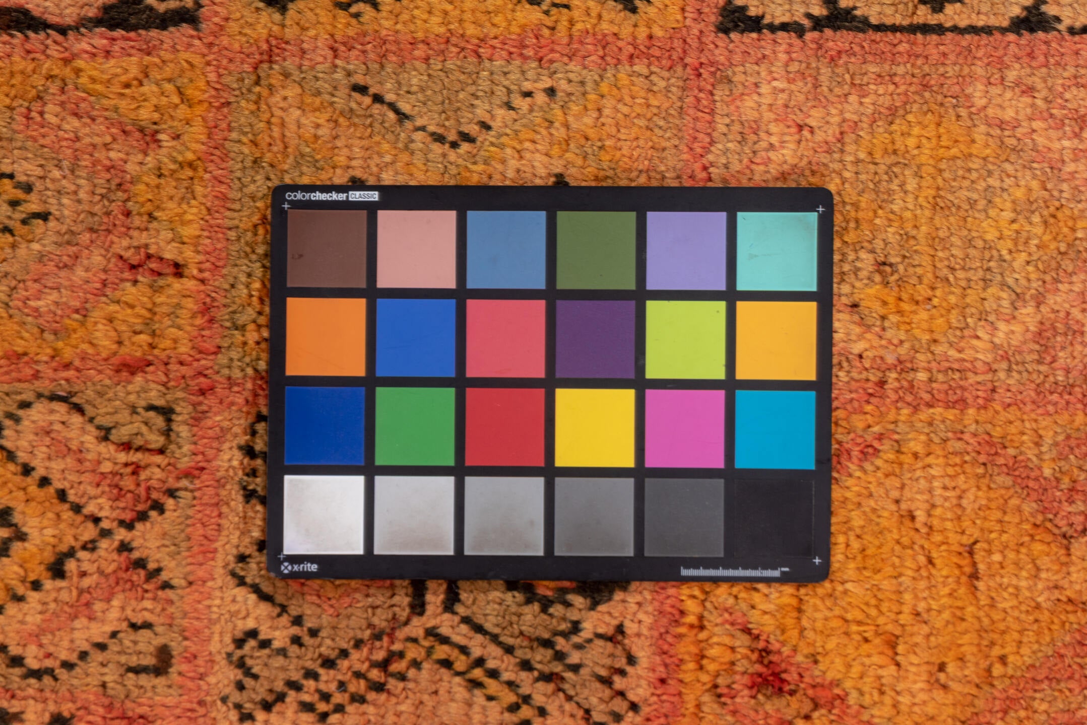 4' x 7' one-of-a-kind handmade vintage Moroccan rug. Color palette: brown, gray, orange, pink, red, sienna