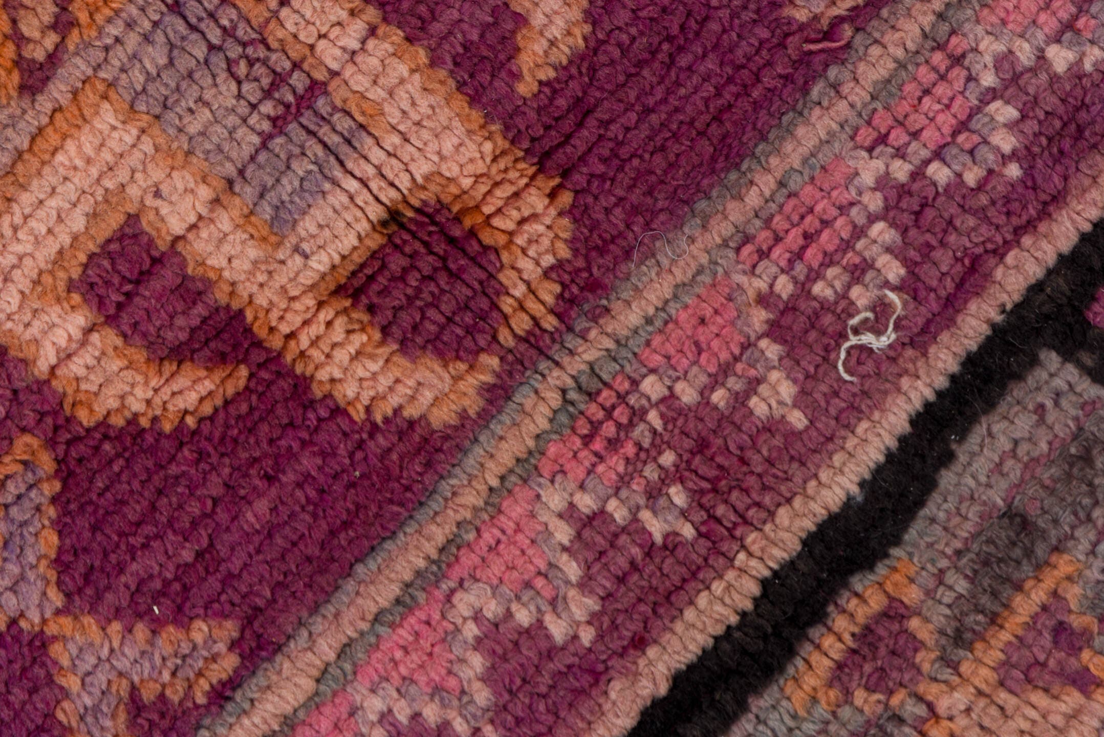 5' x 8' one-of-a-kind handmade vintage Moroccan medium size rug. Color palette: magenta, rose, mauve, peach, plum, lavender