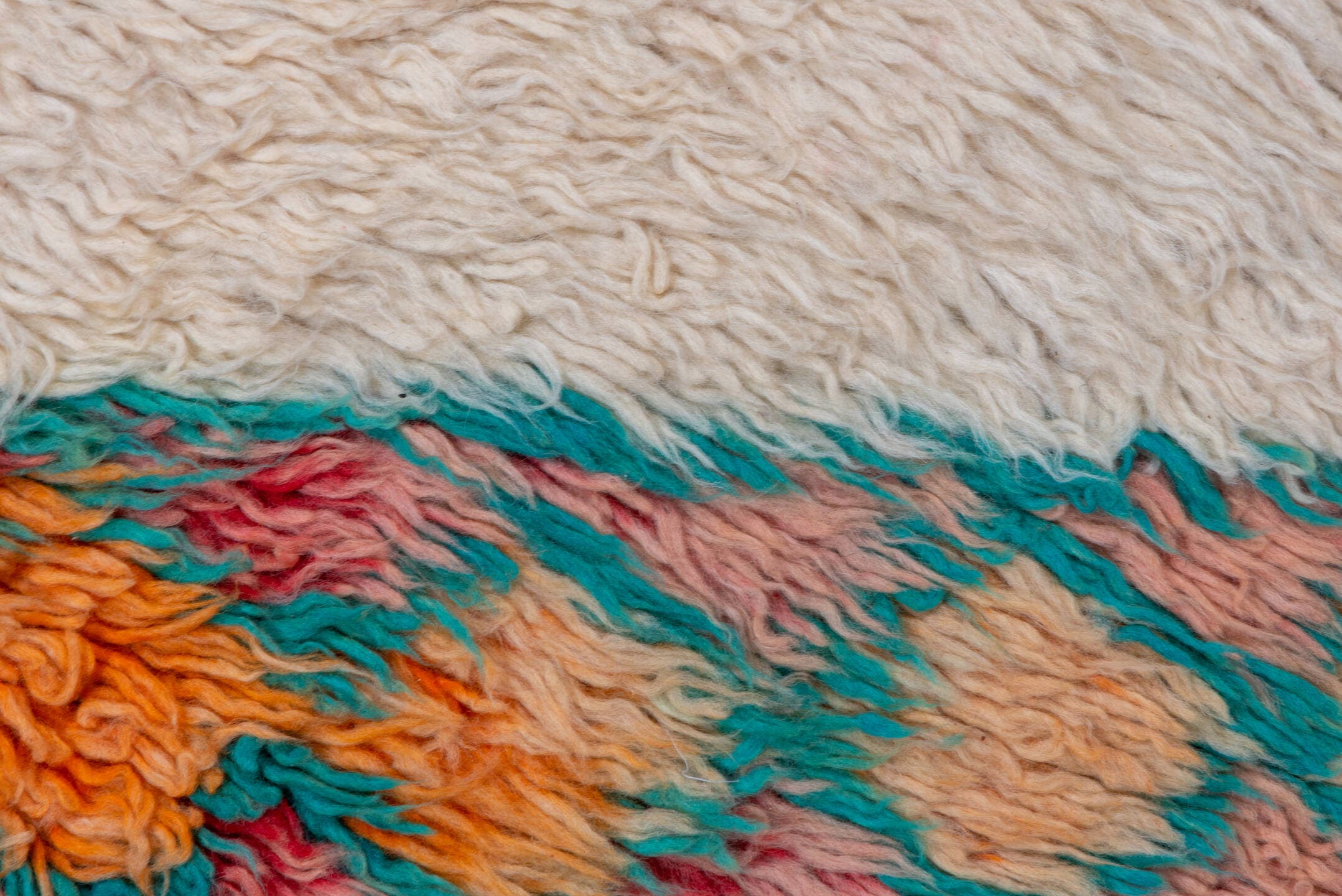 5' x 9' one-of-a-kind handmade vintage Moroccan medium size rug. Color palette: ivory, peach, teal, coral, orange, red