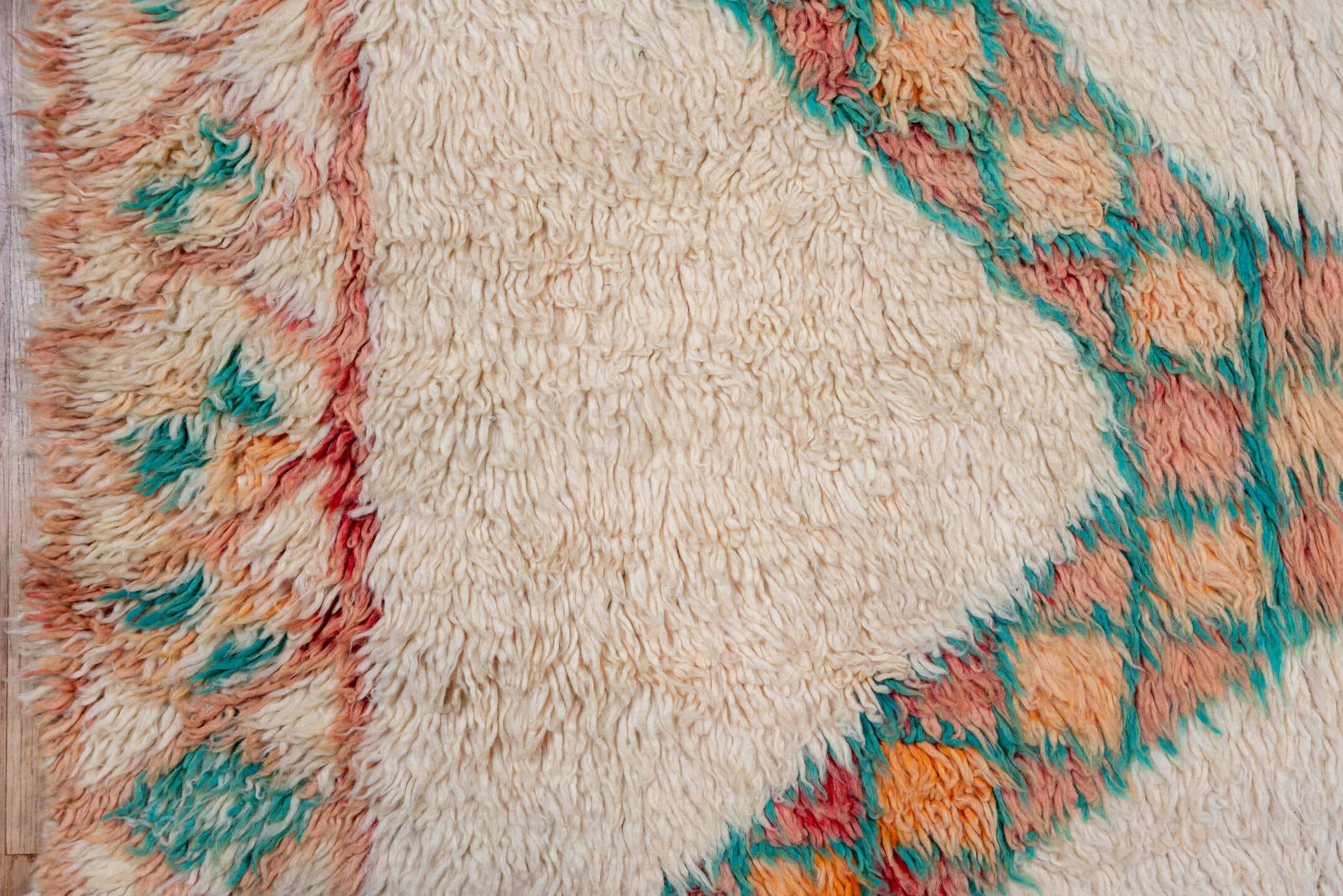 5' x 9' one-of-a-kind handmade vintage Moroccan medium size rug. Color palette: ivory, peach, teal, coral, orange, red