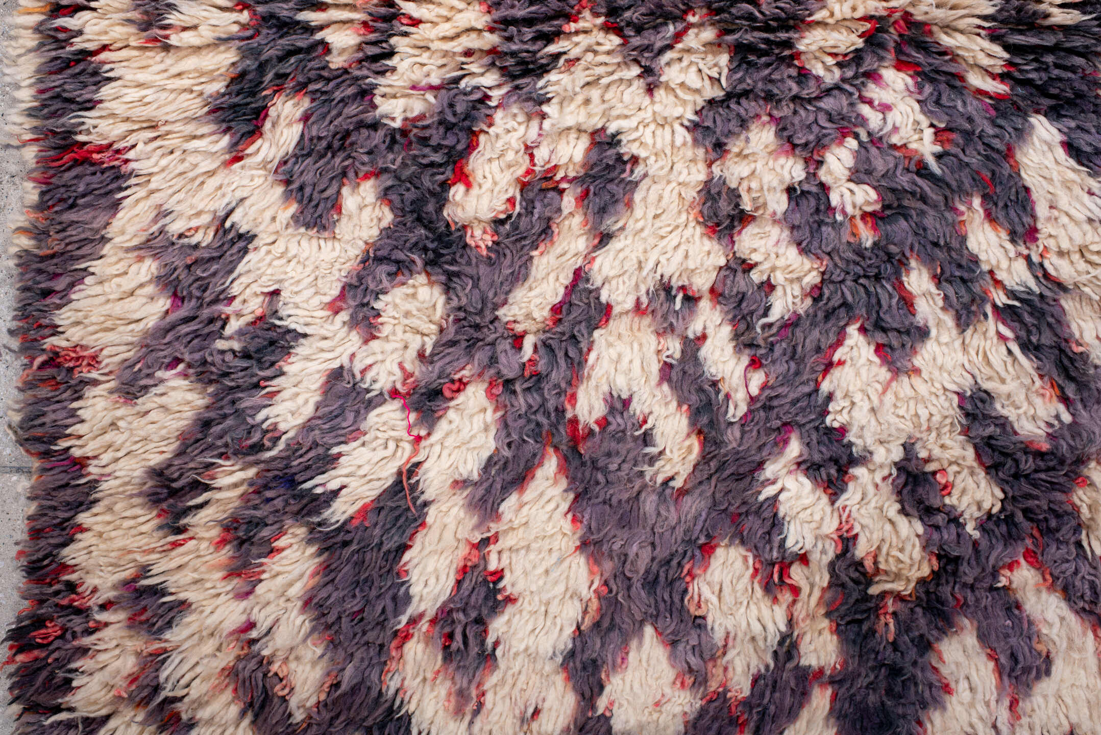 3' x 5' one-of-a-kind handmade vintage Moroccan small size rug. Color palette: ivory, plum, charcoal, crimson, rose, pink
