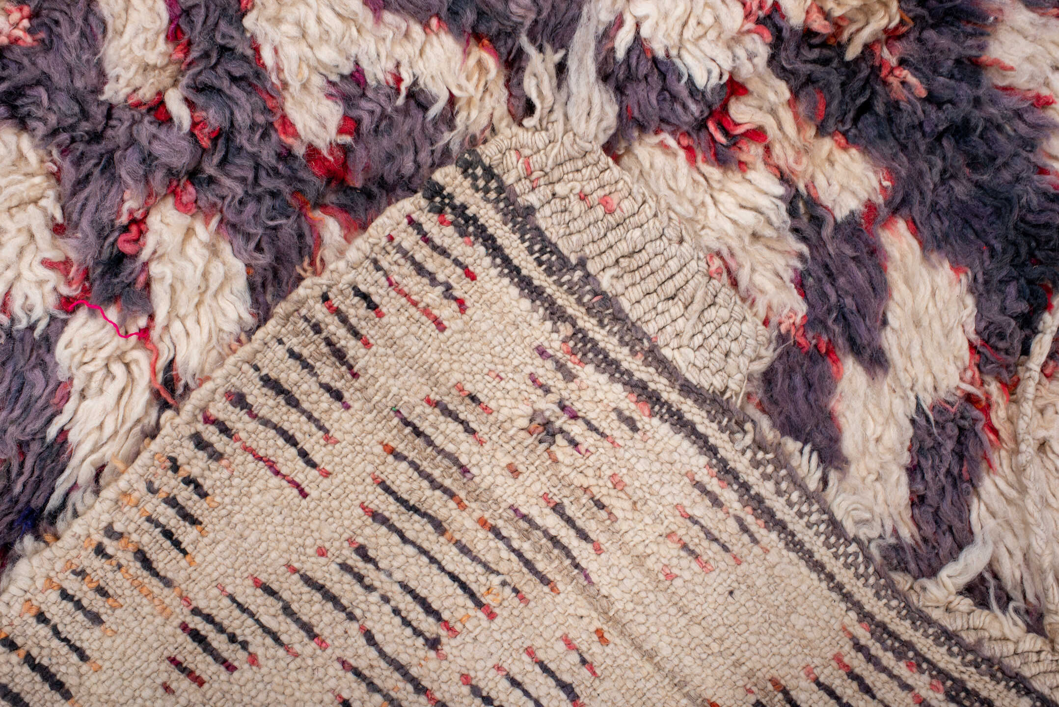 3' x 5' one-of-a-kind handmade vintage Moroccan small size rug. Color palette: ivory, plum, charcoal, crimson, rose, pink