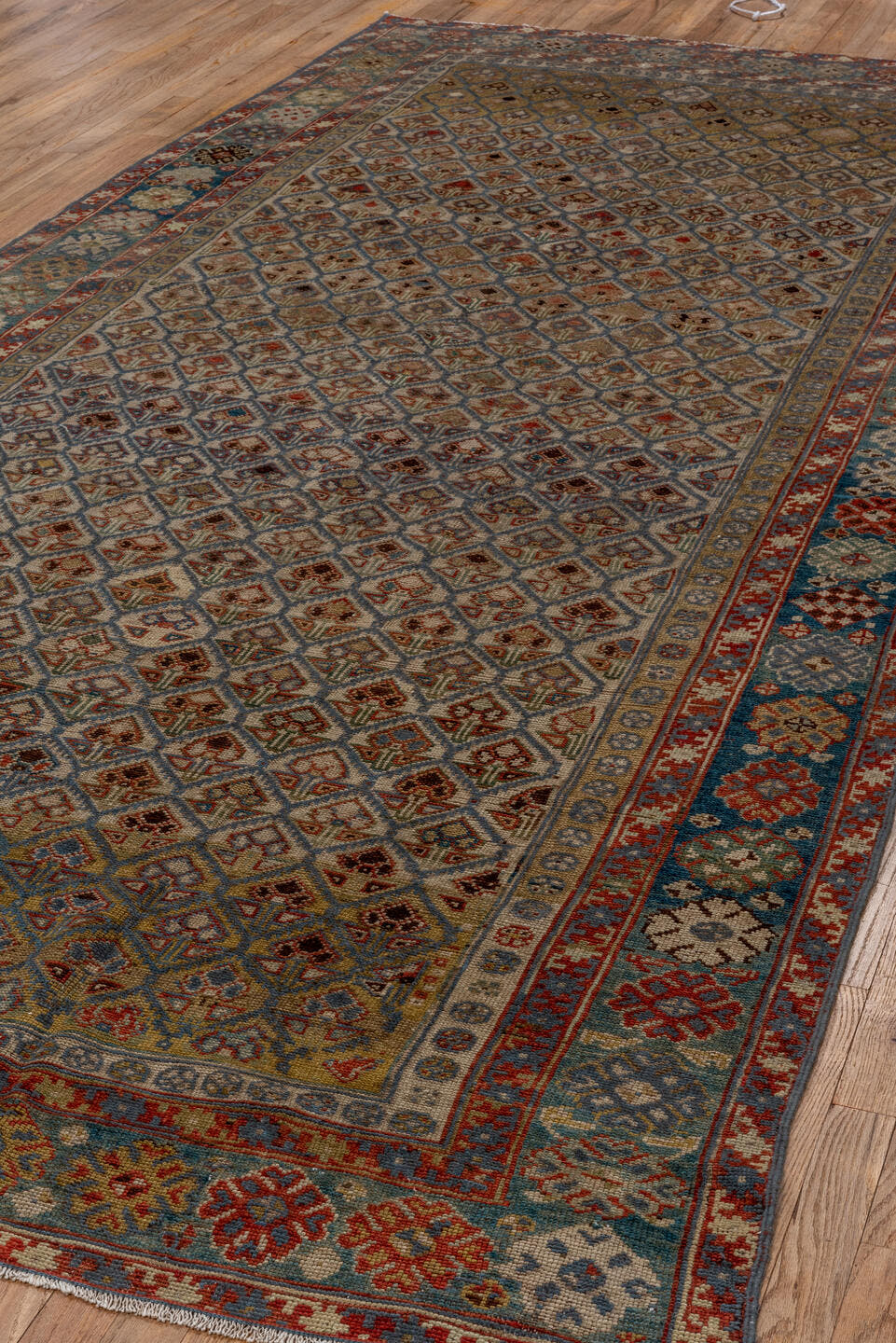 5' x 12' one-of-a-kind handmade antique NW Persian rug. Color palette: camel, ivory, slate, rust, blue, taupe, charcoal
