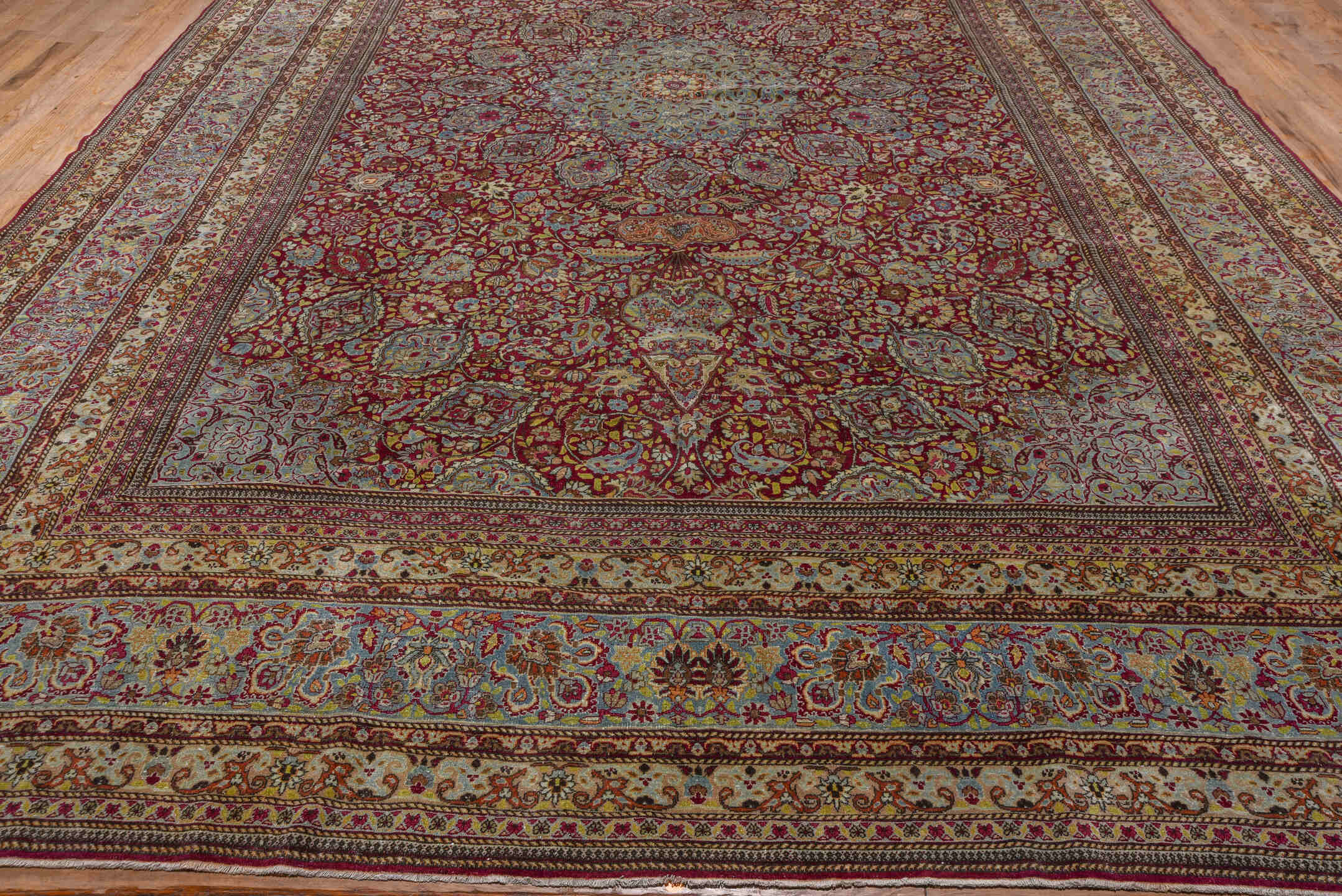 11' x 17' one-of-a-kind handmade antique Kerman oversize rug. Color palette: burgundy, sky blue, ivory, gold, rose, camel