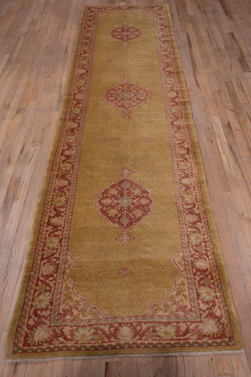 2' x 11' one-of-a-kind handmade antique Oushak runner rug. Color palette: camel, rose, terra cotta, ivory, tan, beige, pink