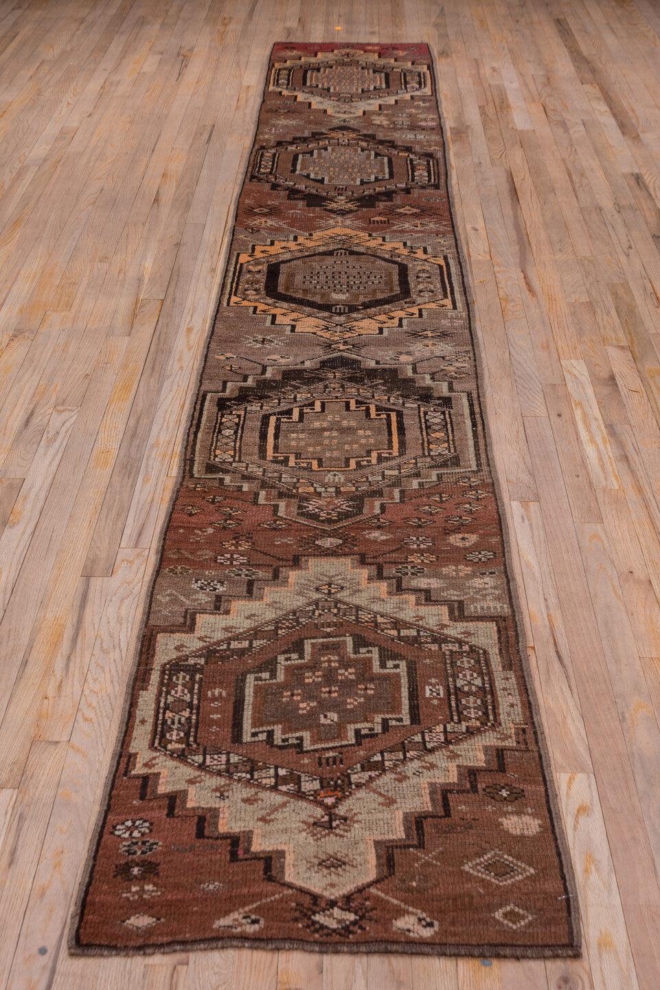 2' x 14' one-of-a-kind handmade vintage Kars runner rug. Color palette: brown, gray, pink, redwood
